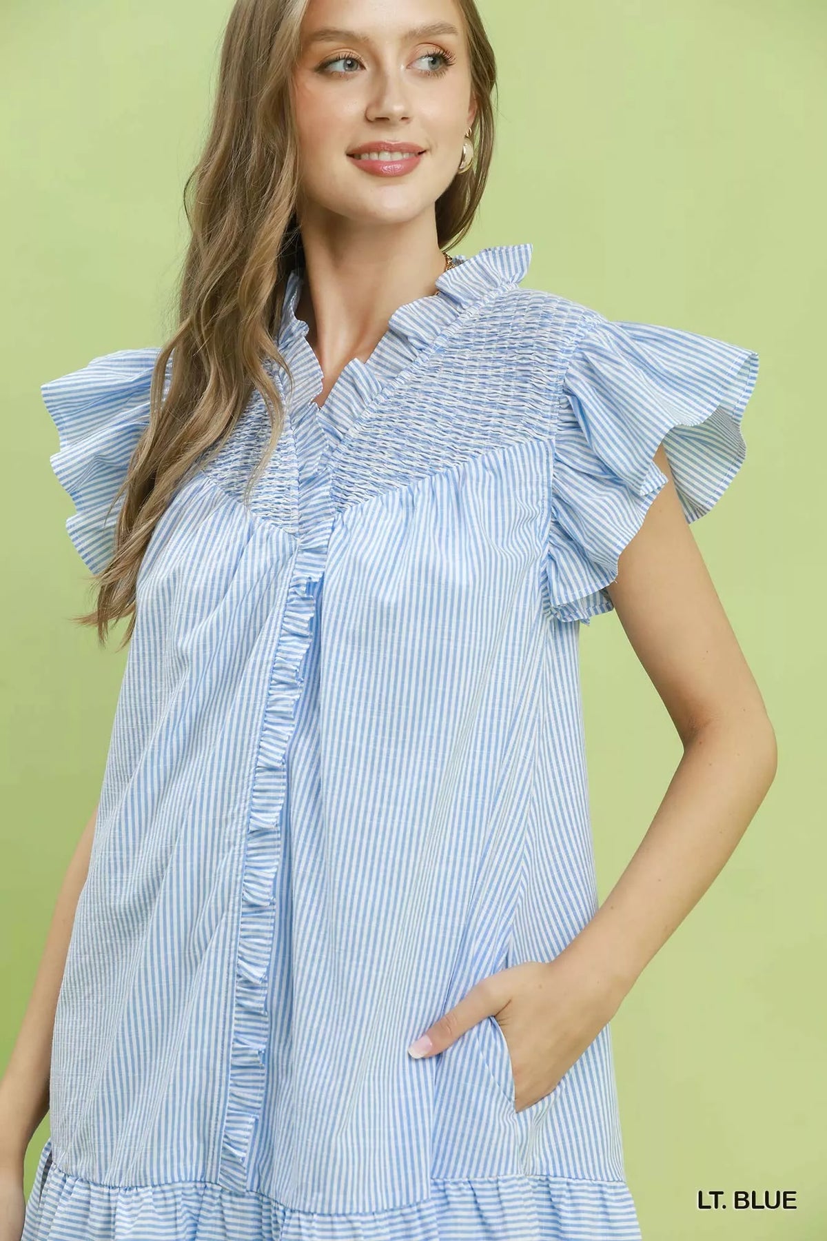 Light blue striped smocked yoke ruffle dress close up view