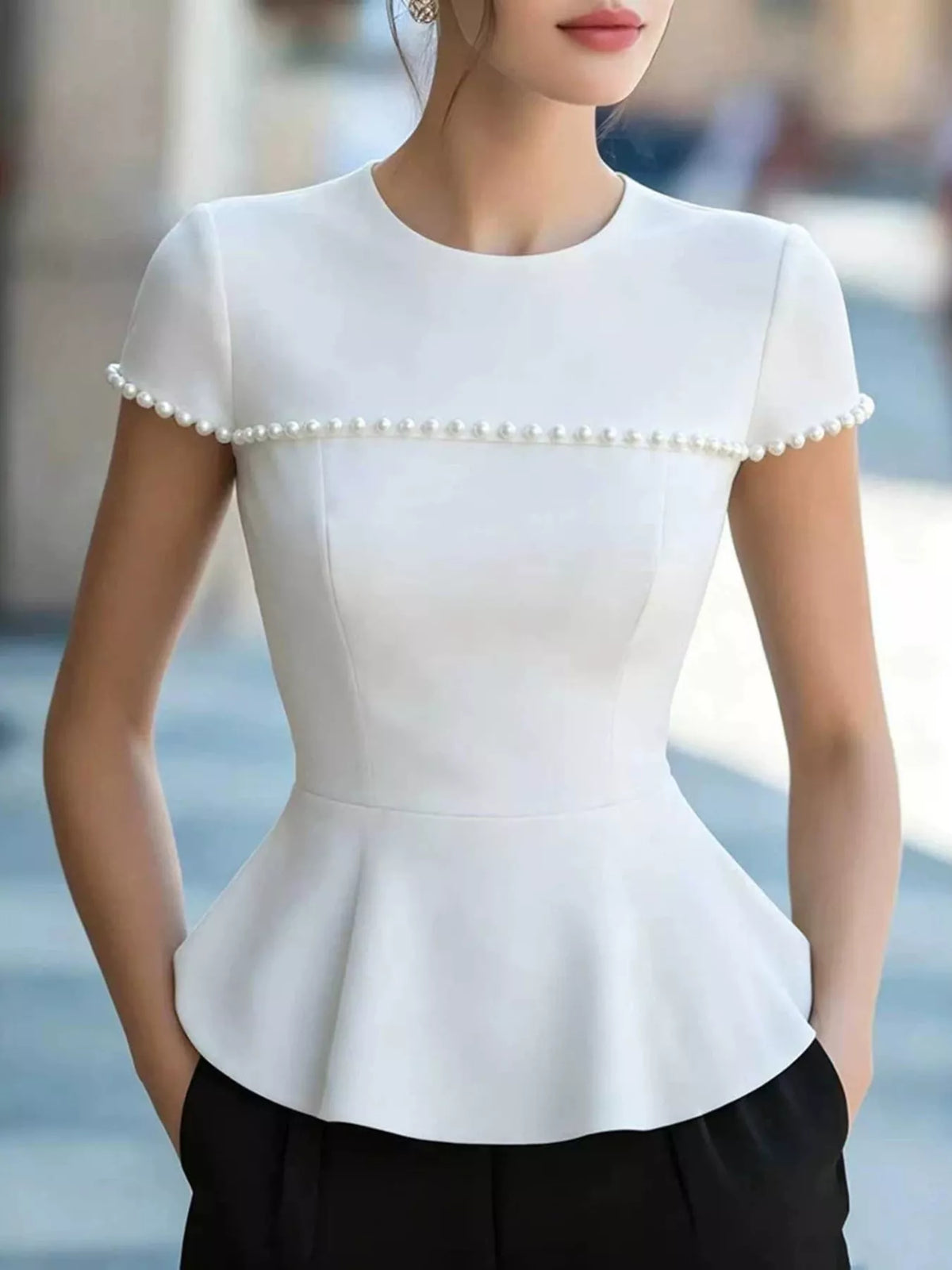 Hemline detail of the flared peplum tee