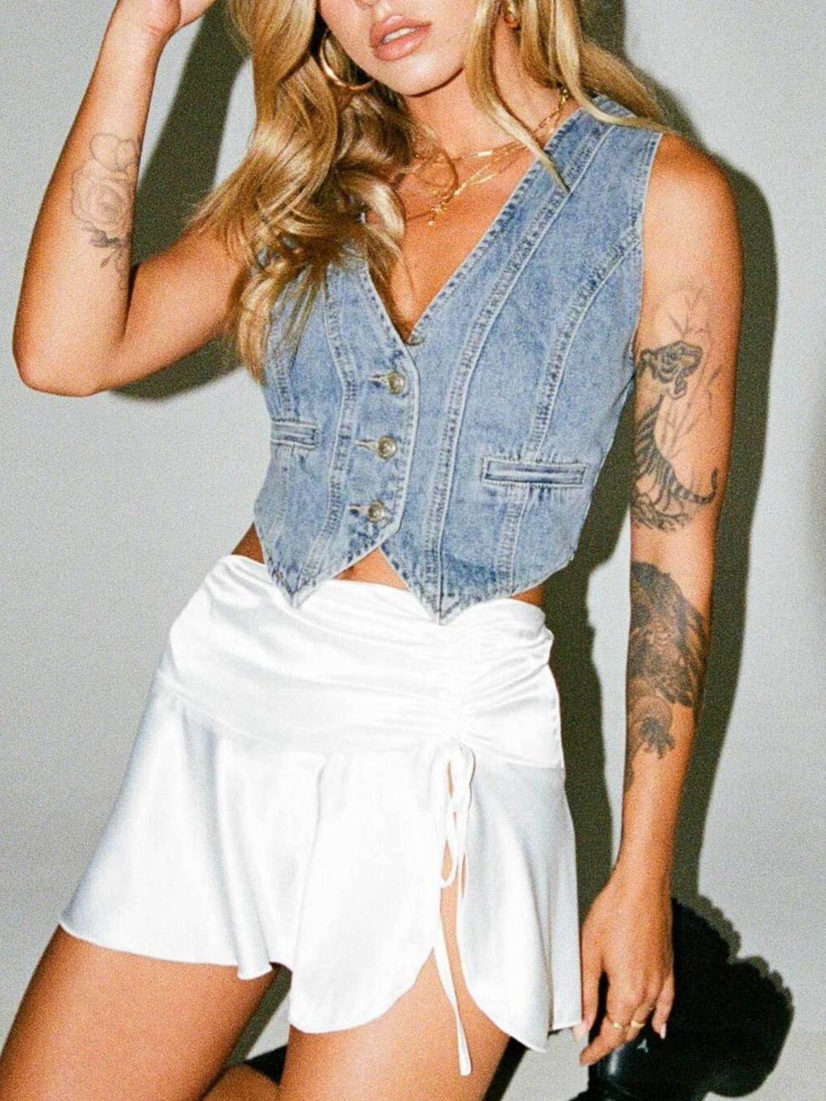 V Neck Button Up Denim Vest in Light Wash on model