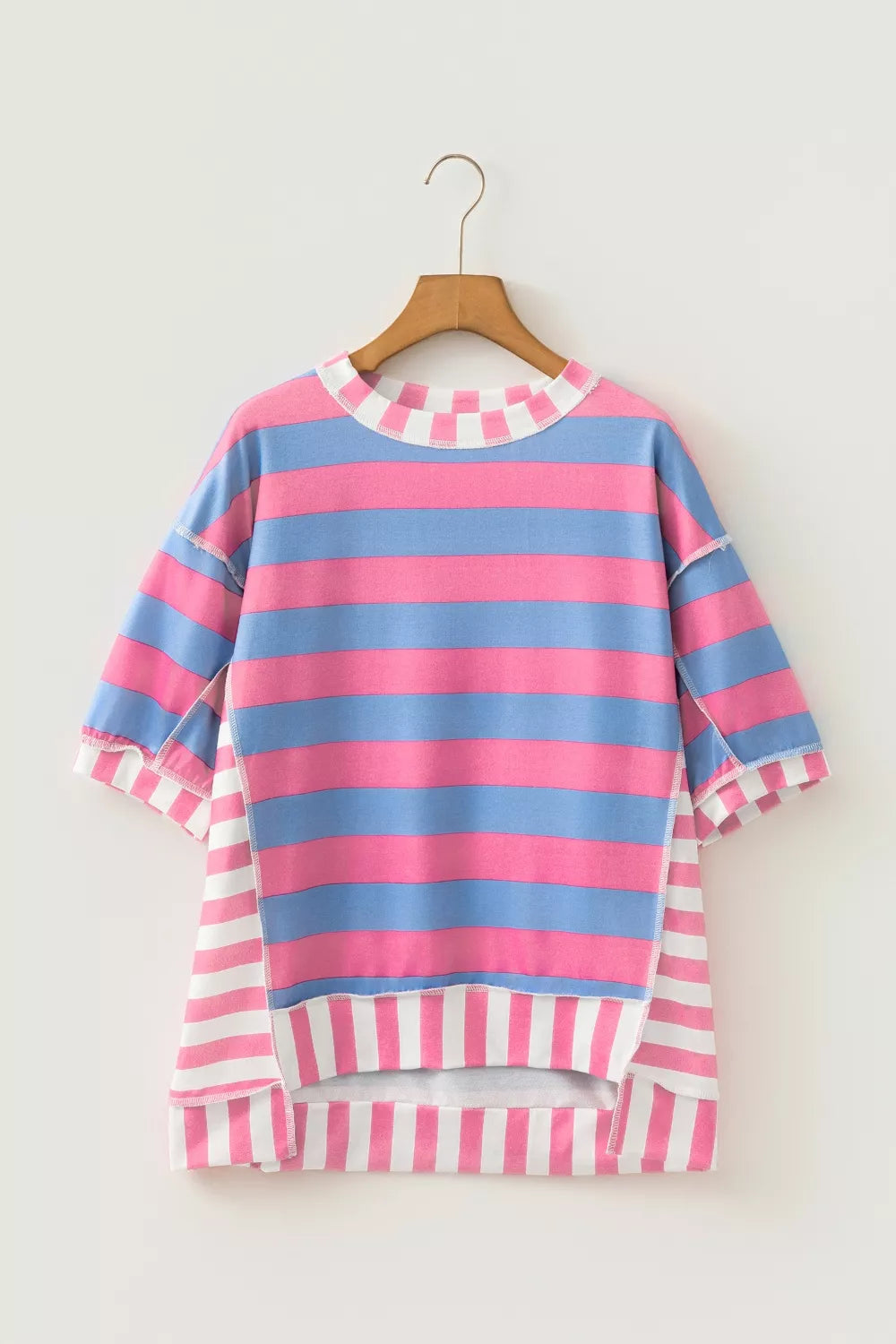 Back view of the striped patchwork oversized top in pink