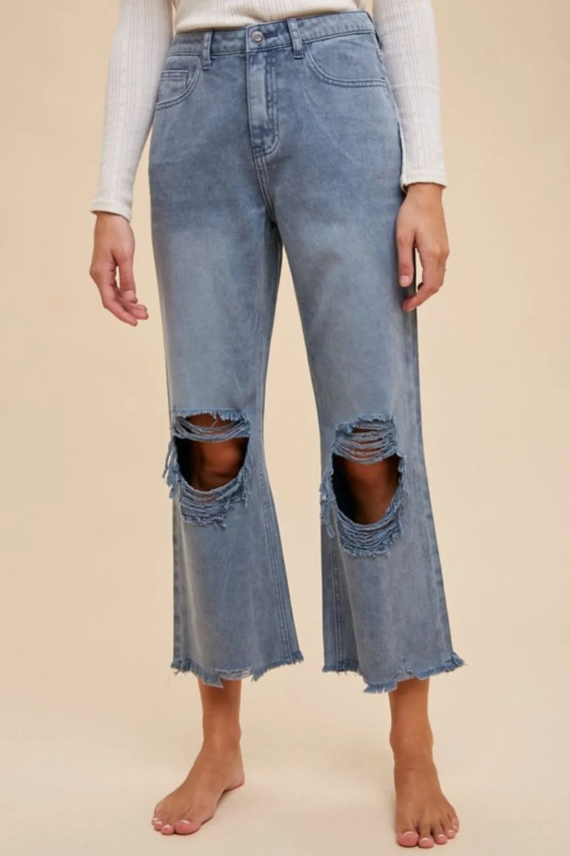 Dusty blue distressed raw hem jeans front