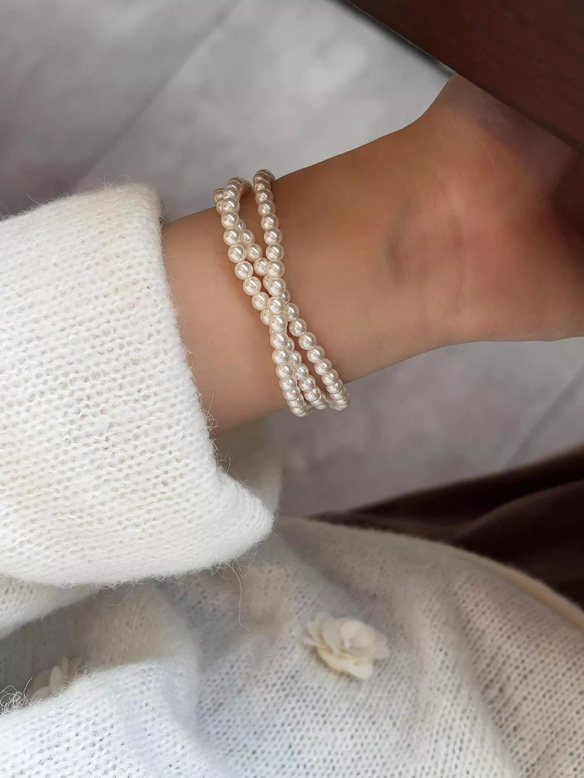 Layered pearl bracelet detail