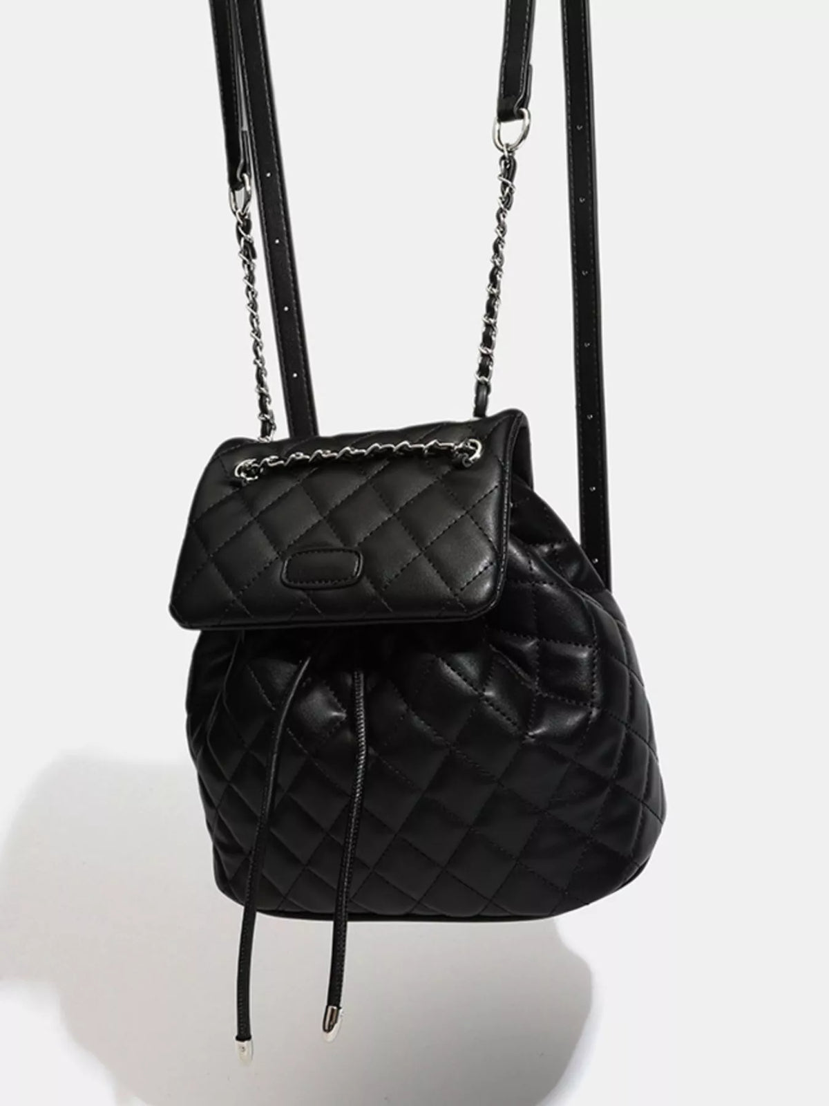 Black quilted chain flap backpack interior compartment