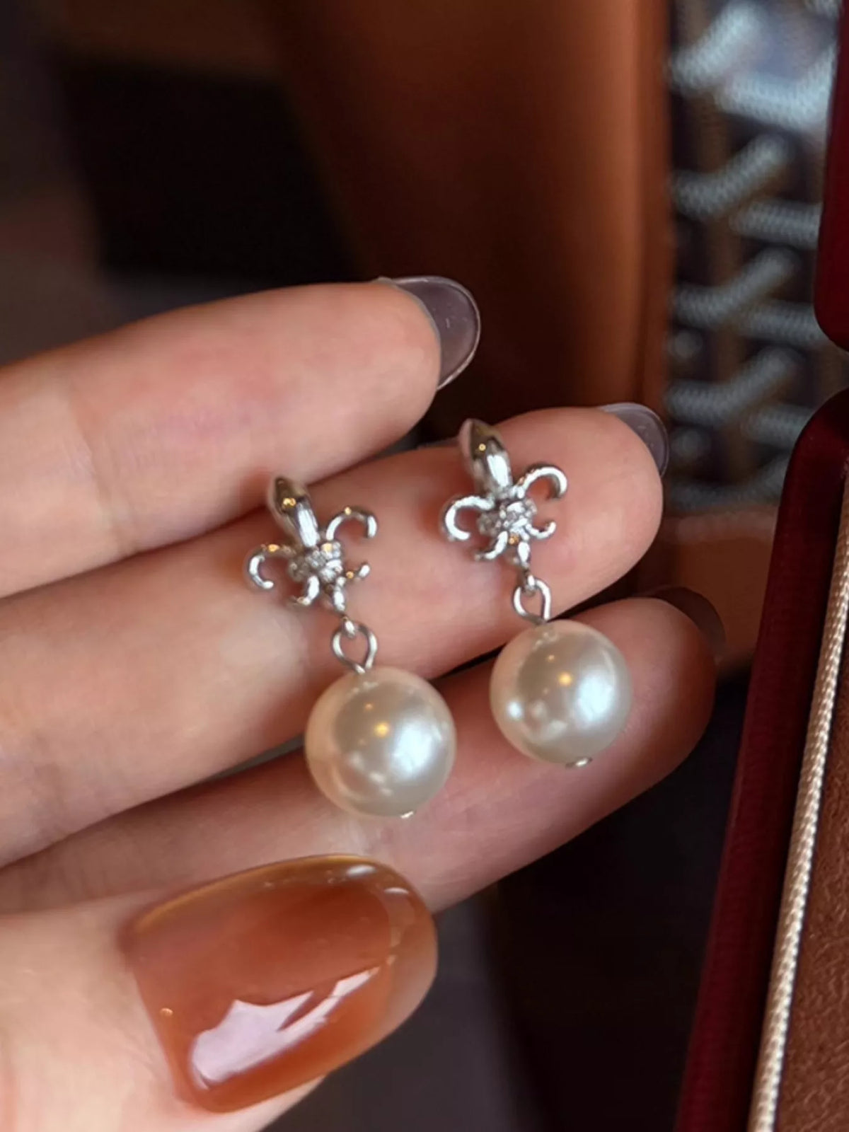 Pearl drop earrings side view