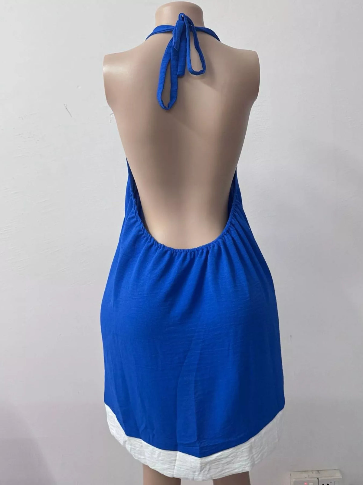 Halter mini dress styled with heels