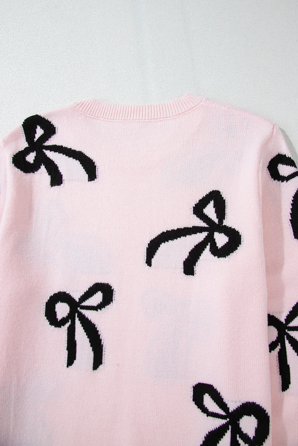 Blush oversized bow sweater side profile