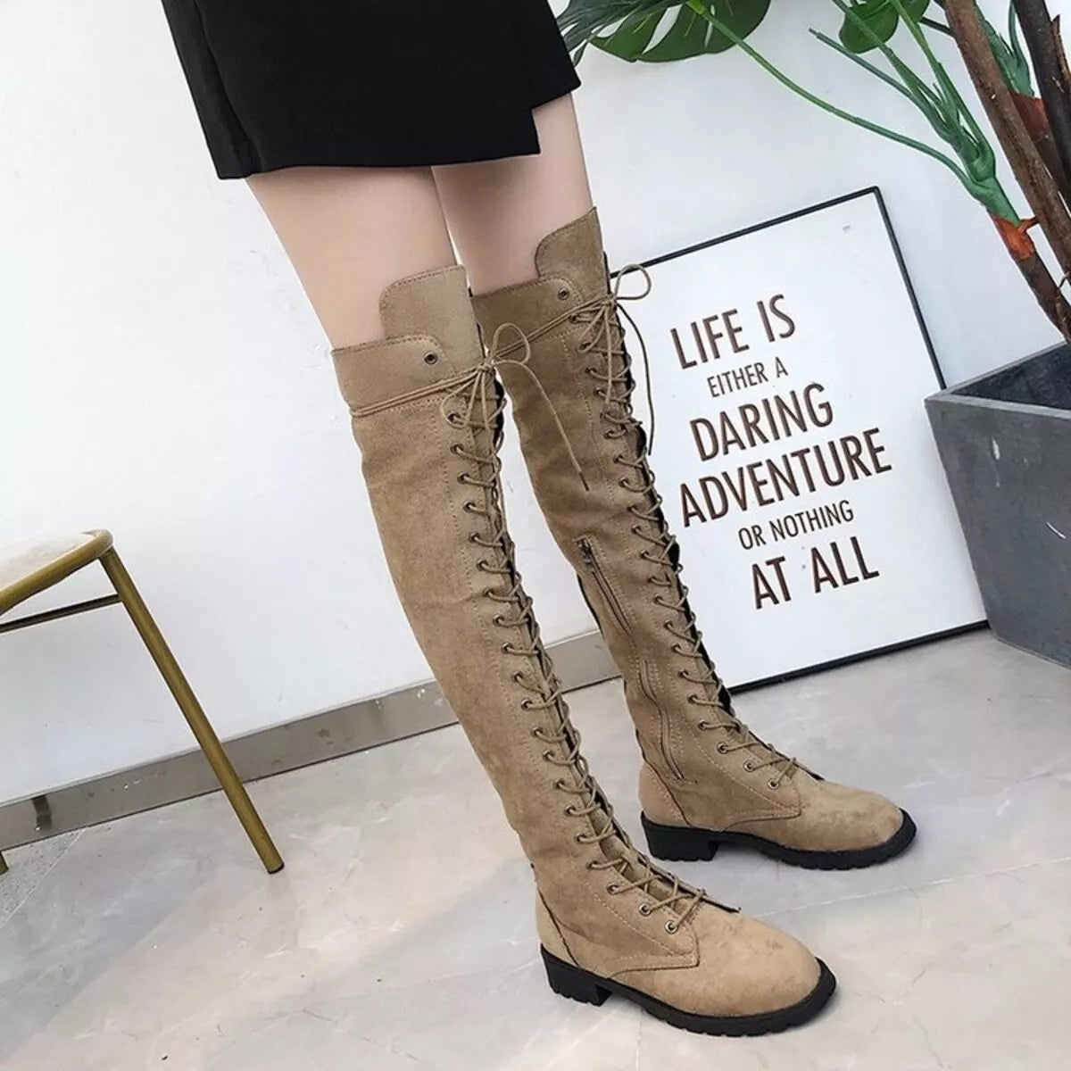 Lace up over the knee boots sole view
