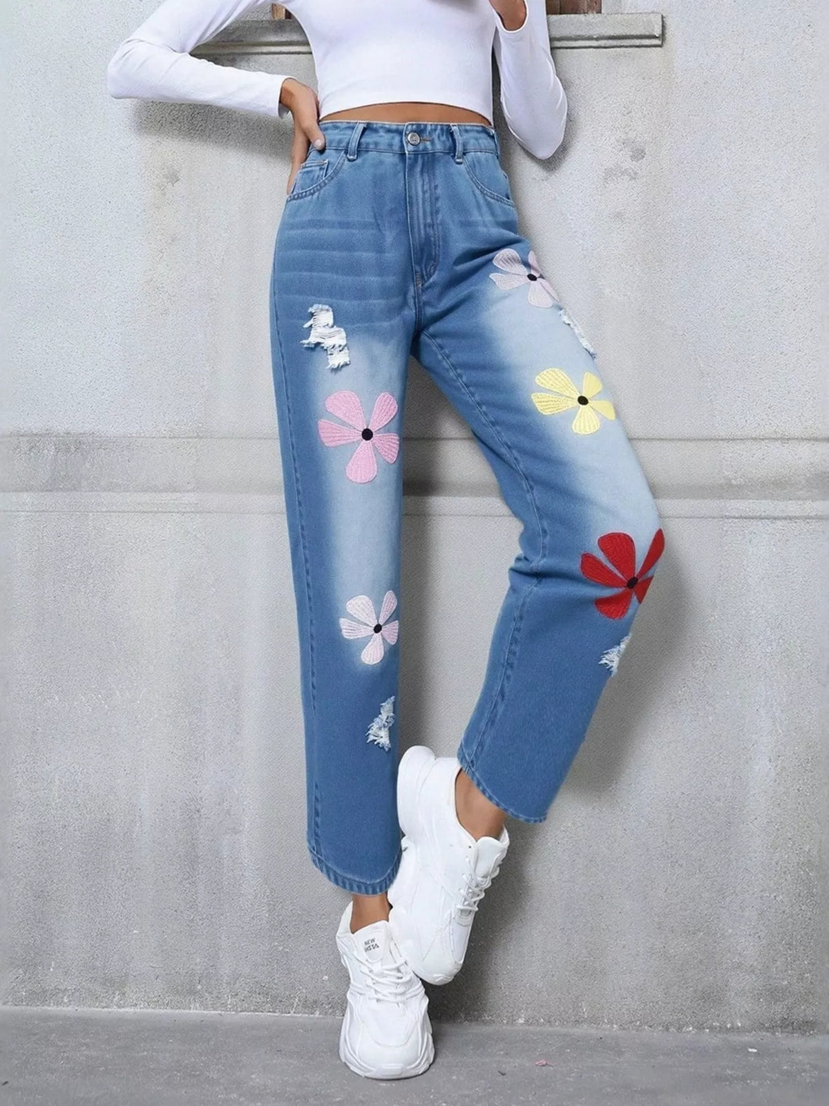 Back view of high waist embroidered denim