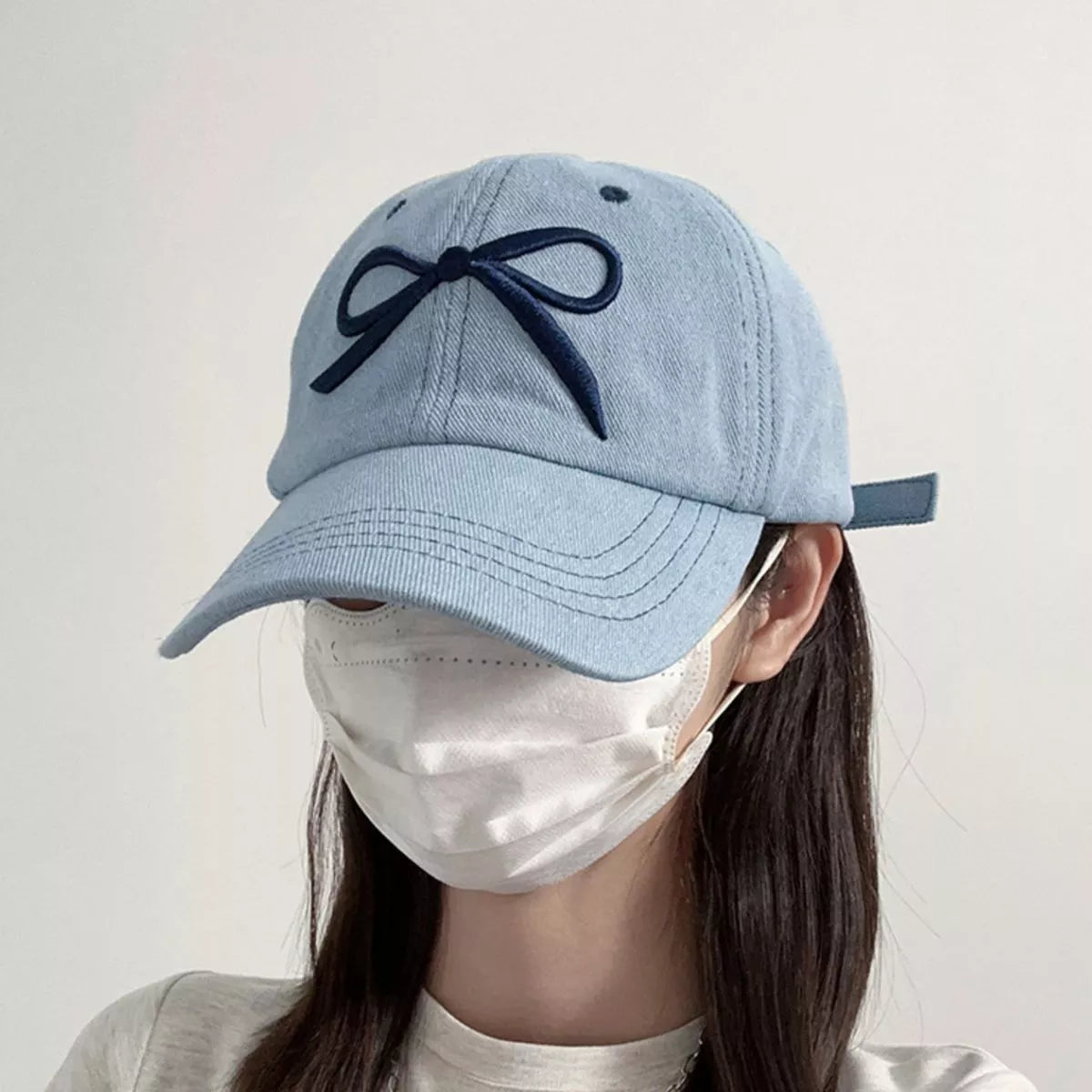 Angled view of the light blue cotton cap