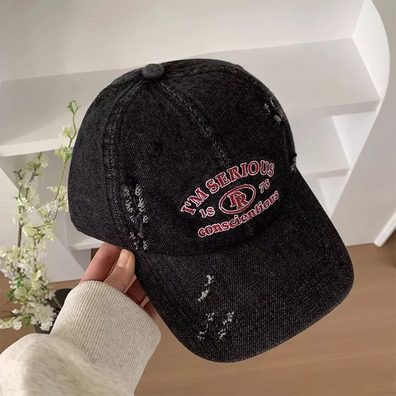 Embroidered cap crown and panel texture