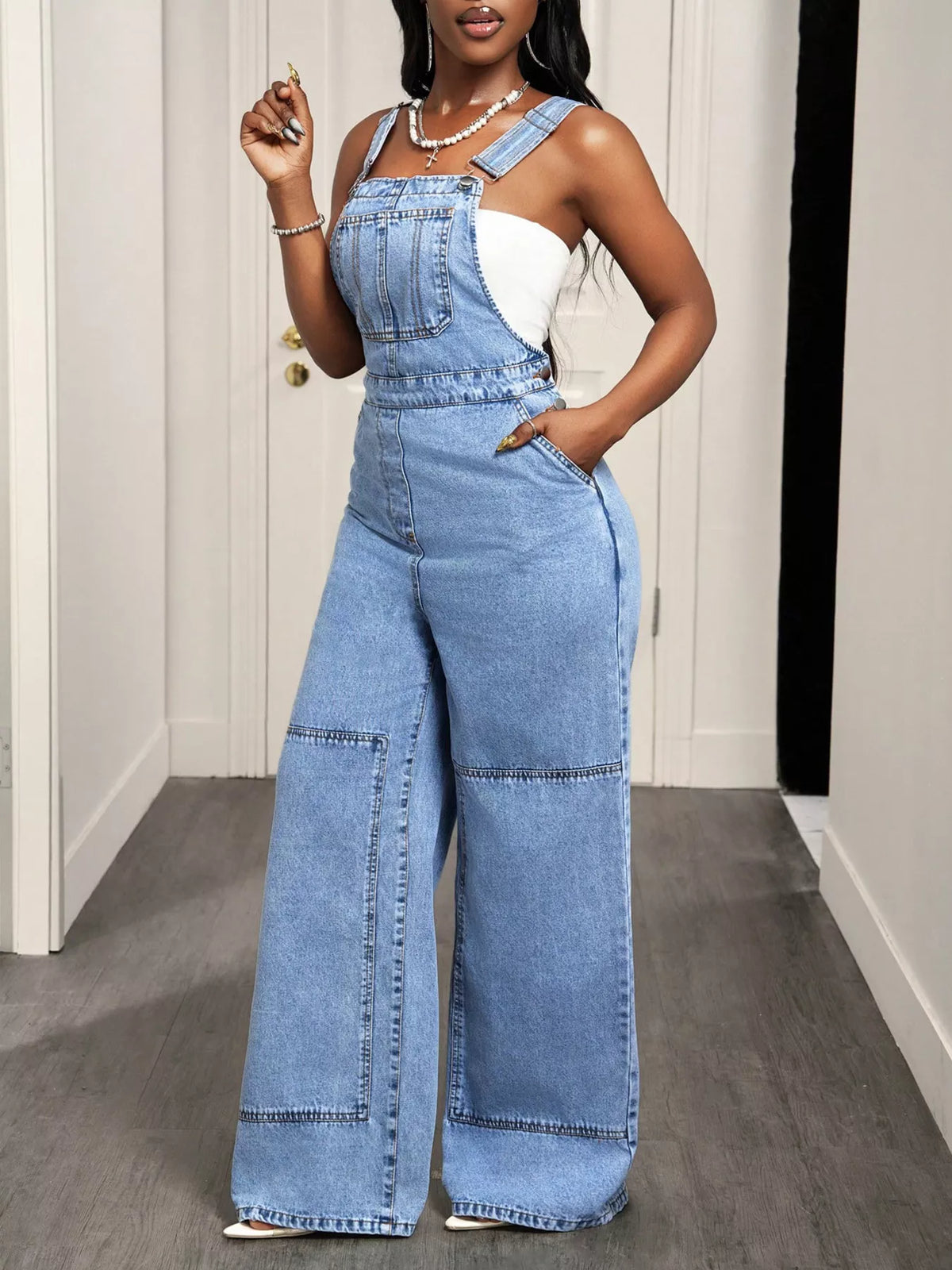 Blue wide leg denim overalls side view
