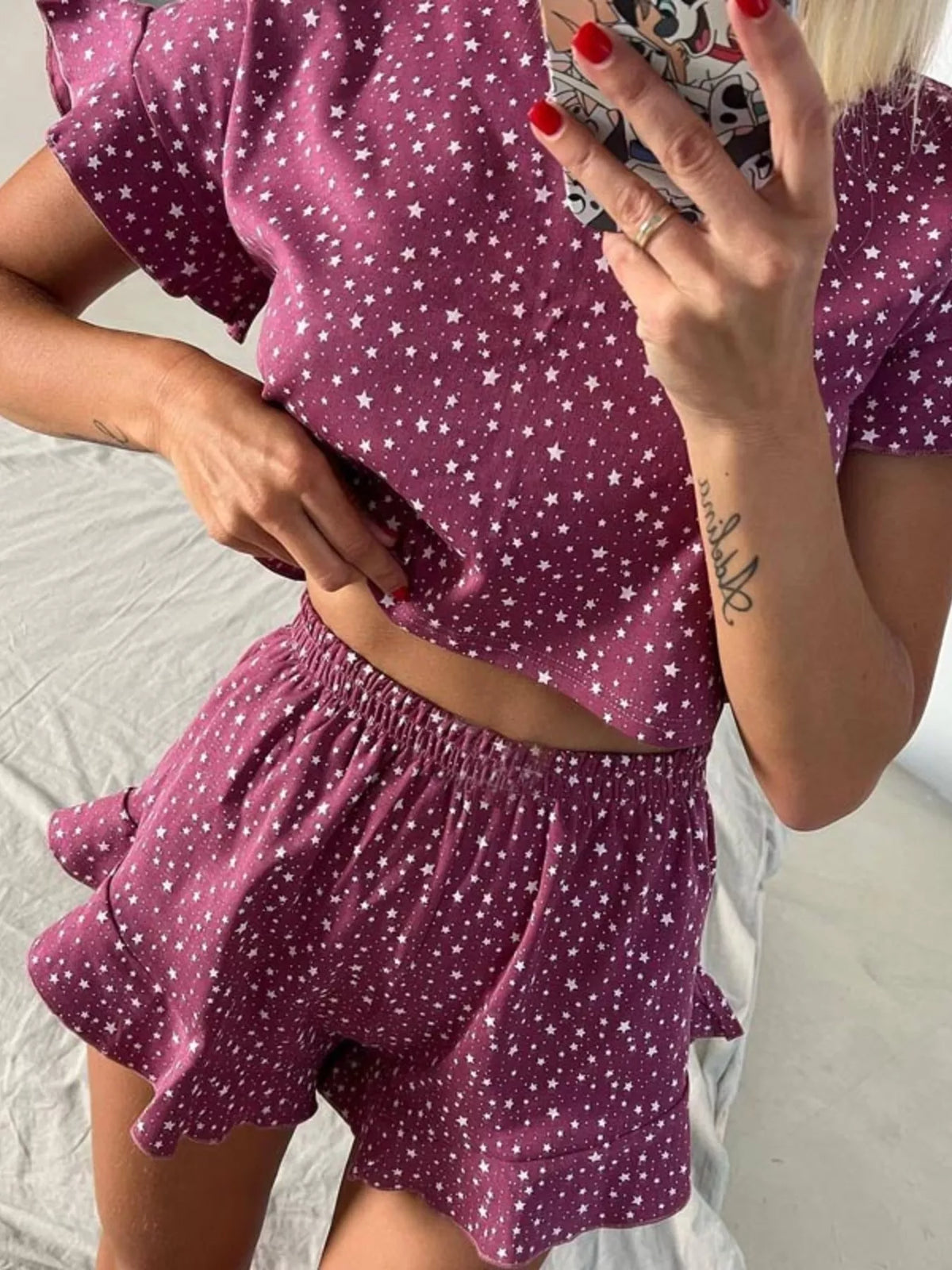Printed crop top and ruffled shorts styled outfit