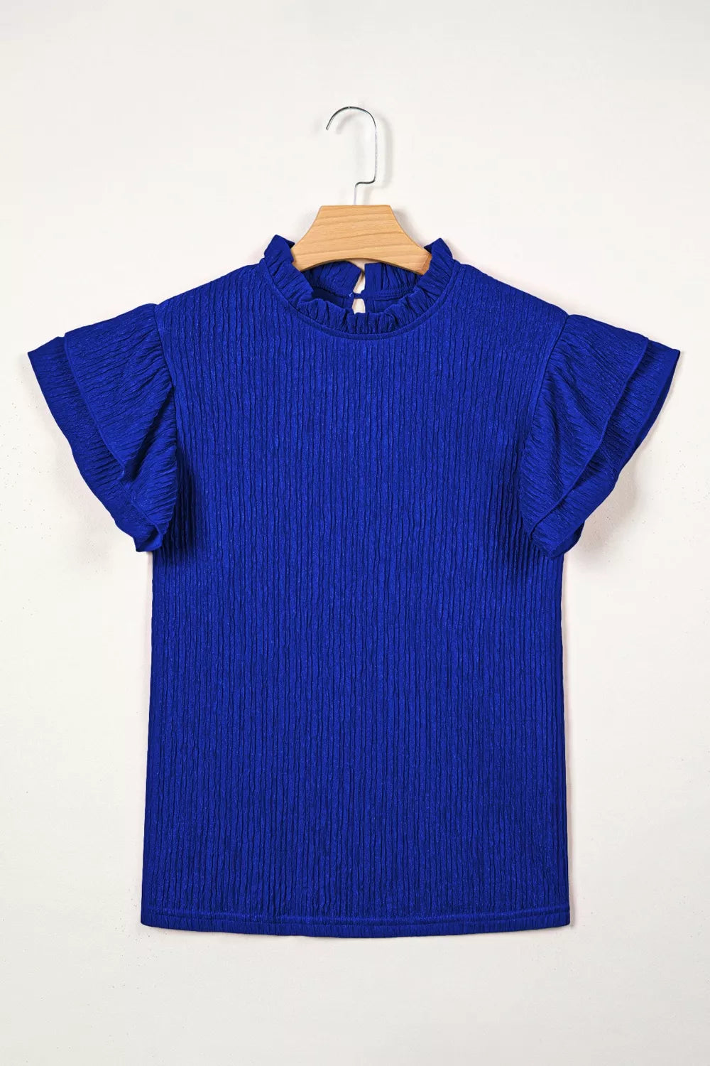 Navy textured ruffle trim short sleeve blouse styled view