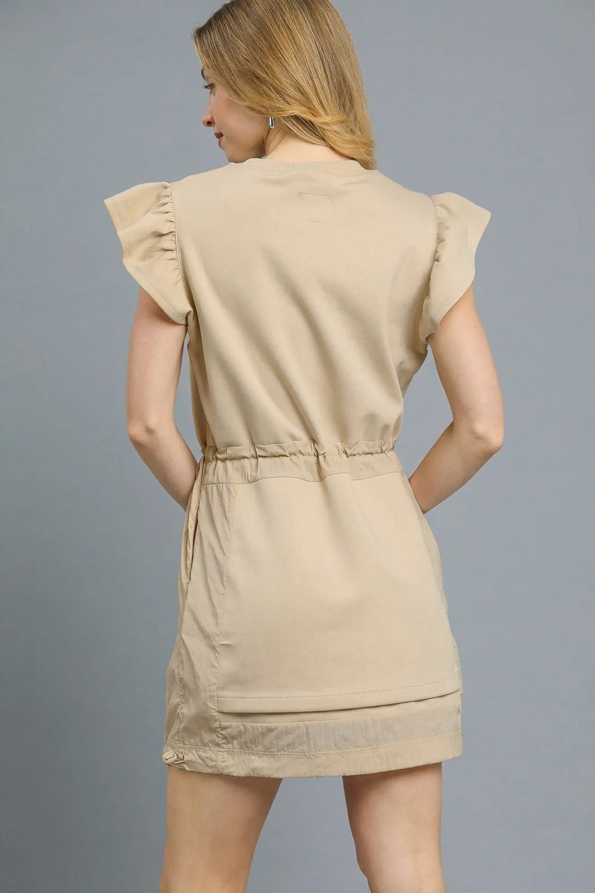 Ruffle sleeve mini dress showing tie waist