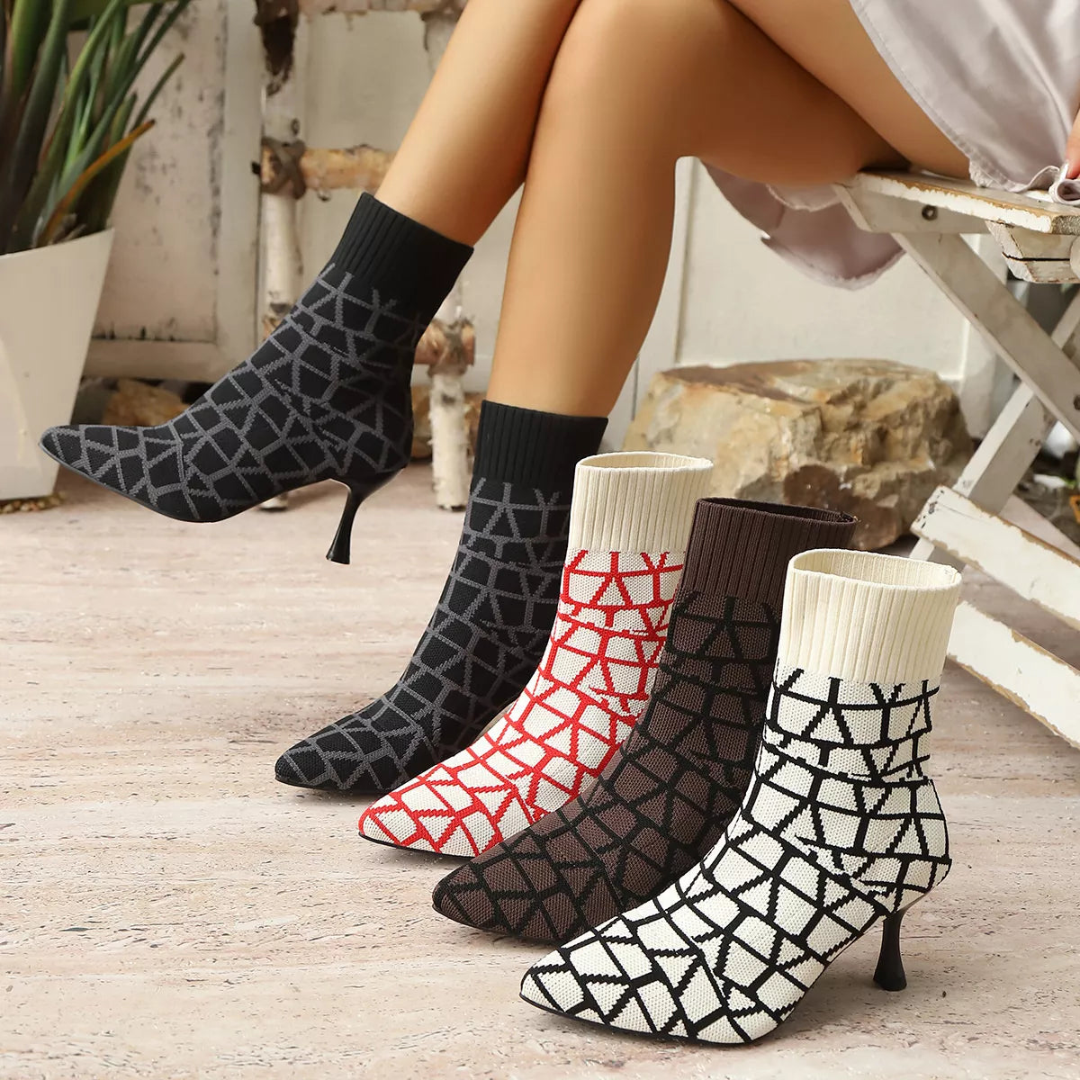 Black point toe flared heel boots side profile view