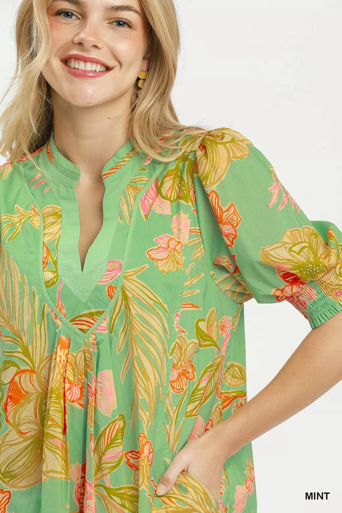 Mint botanical print boho dress with smocked cuffs front view