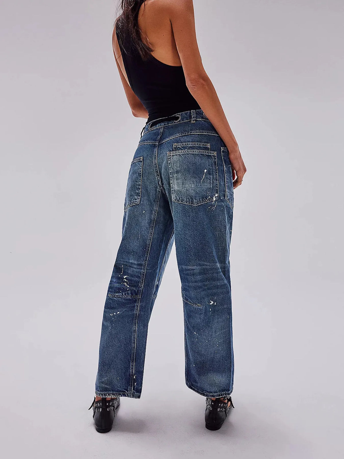 Washed jeans waist close up