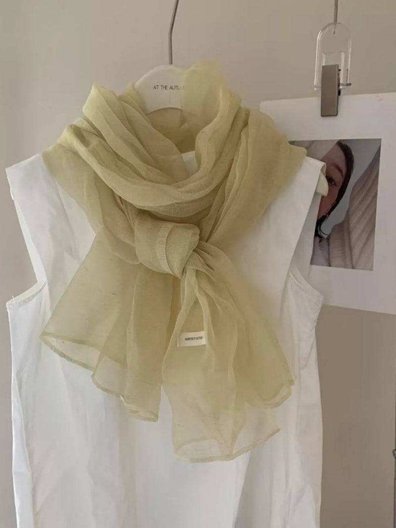 Lightweight sheer scarf in a soft creamy yellow