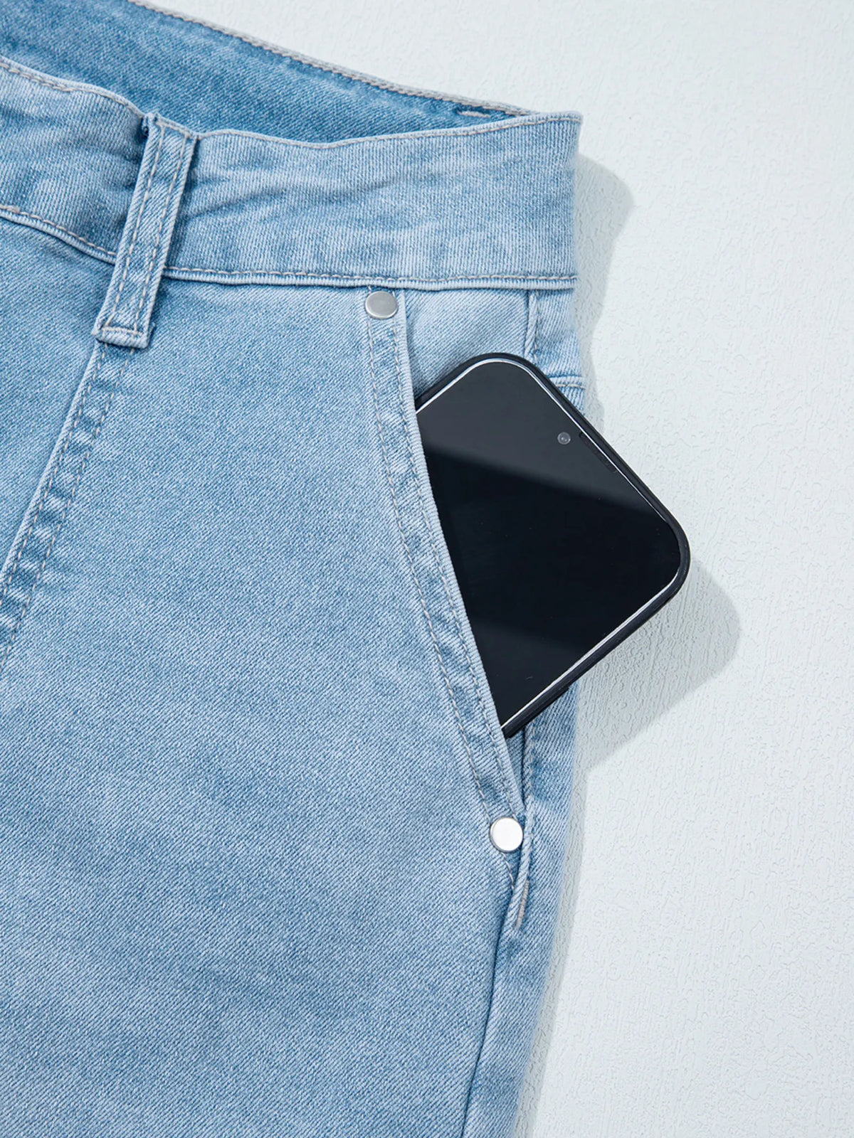 Barrel leg shape on blue jeans