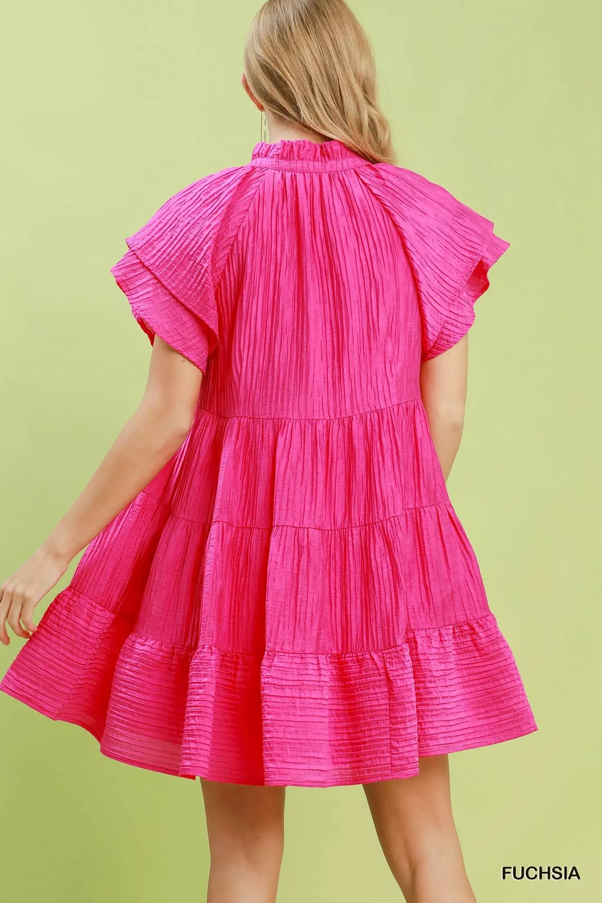 Fuchsia tiered ruffle sleeve textured mini dress side view