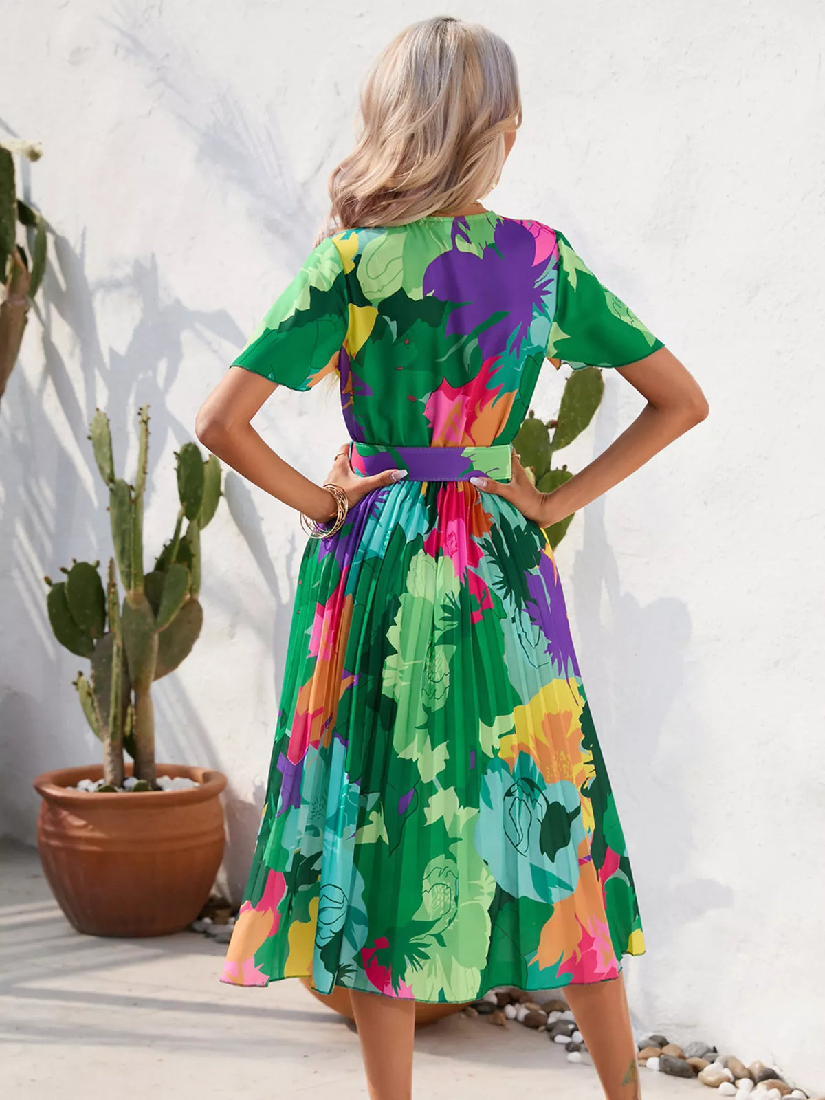 Full length styling shot of the pleated midi dress
