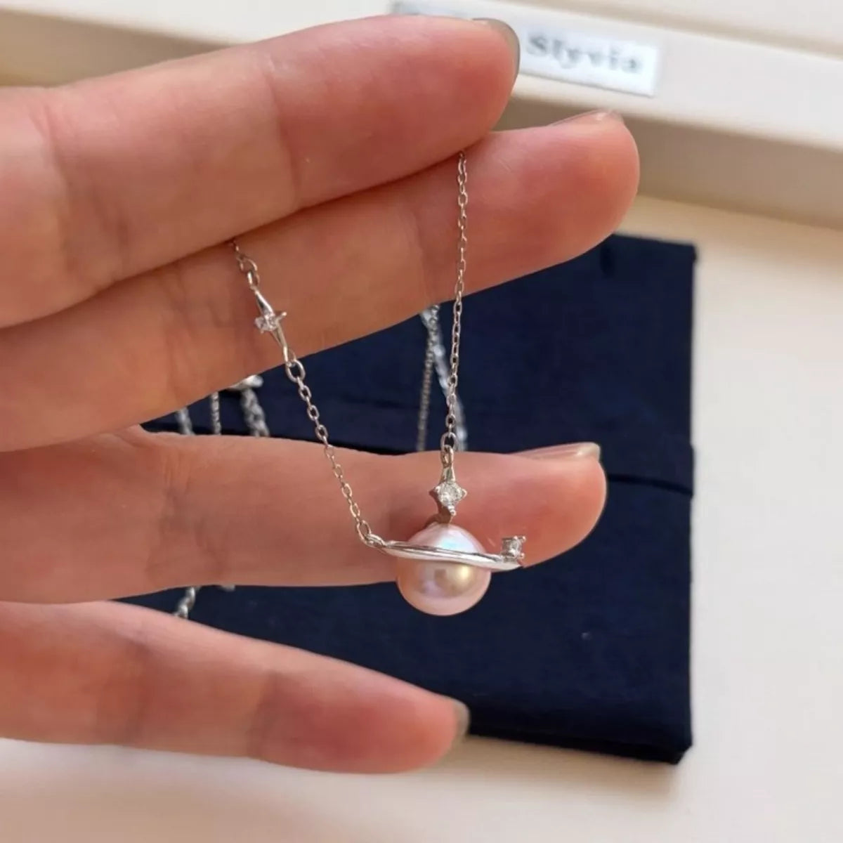 Planet pearl pendant necklace on sterling silver chain full length view
