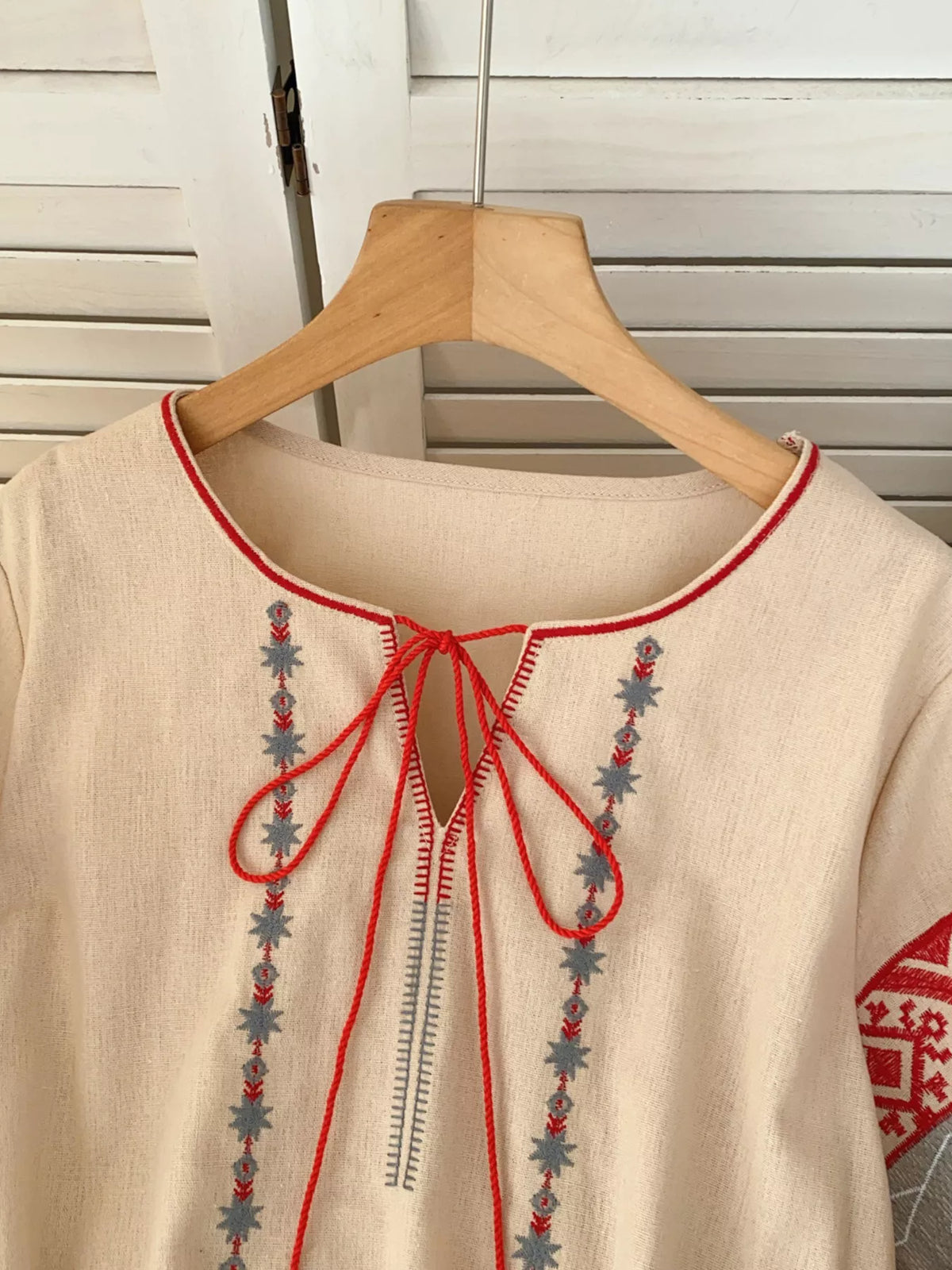 Embroidered tie neck blouse side view