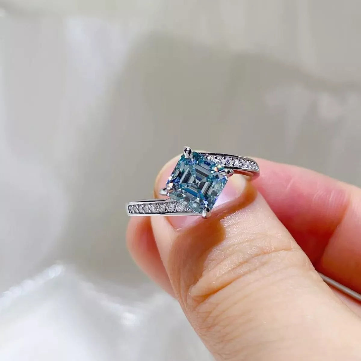 Two carat moissanite ring shown from the side to display the setting