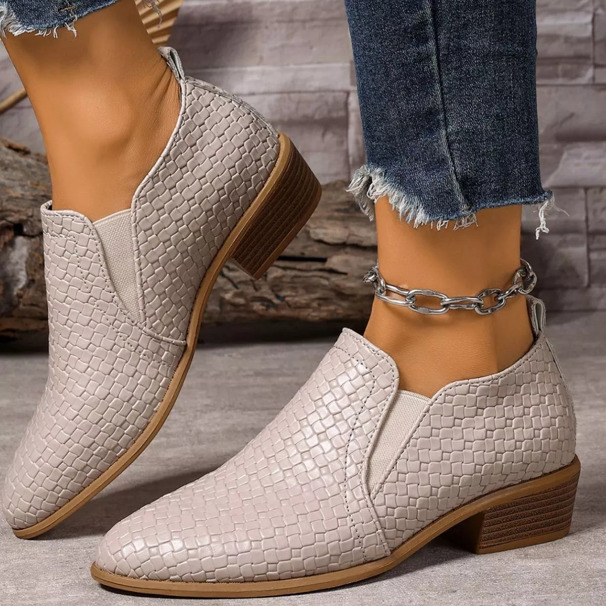 Brown point toe block heels ankle boots angled three quarter view
