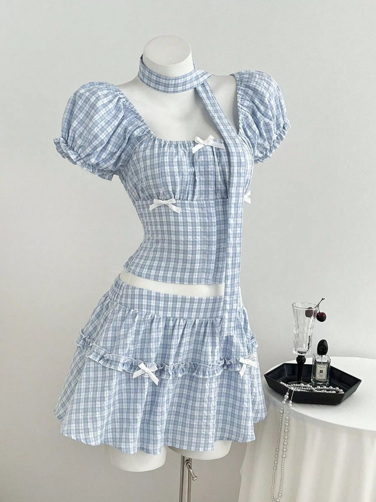 Coordinated plaid blouse and skirt set detail