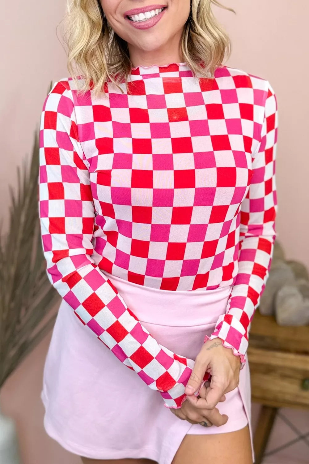 Close up of plaid heart pattern on sheer mesh top