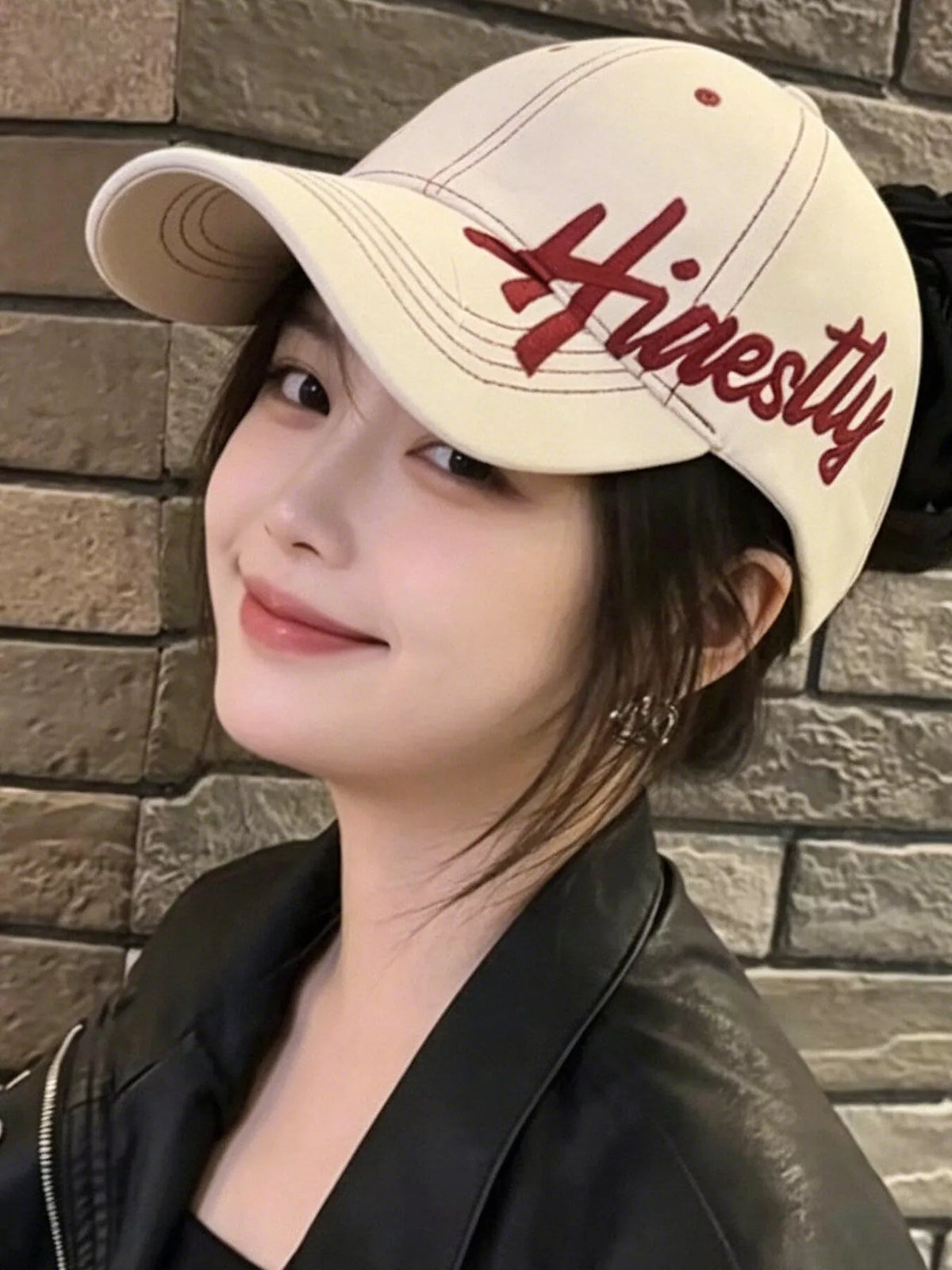 Front embroidery detail on the crown of the cotton baseball cap
