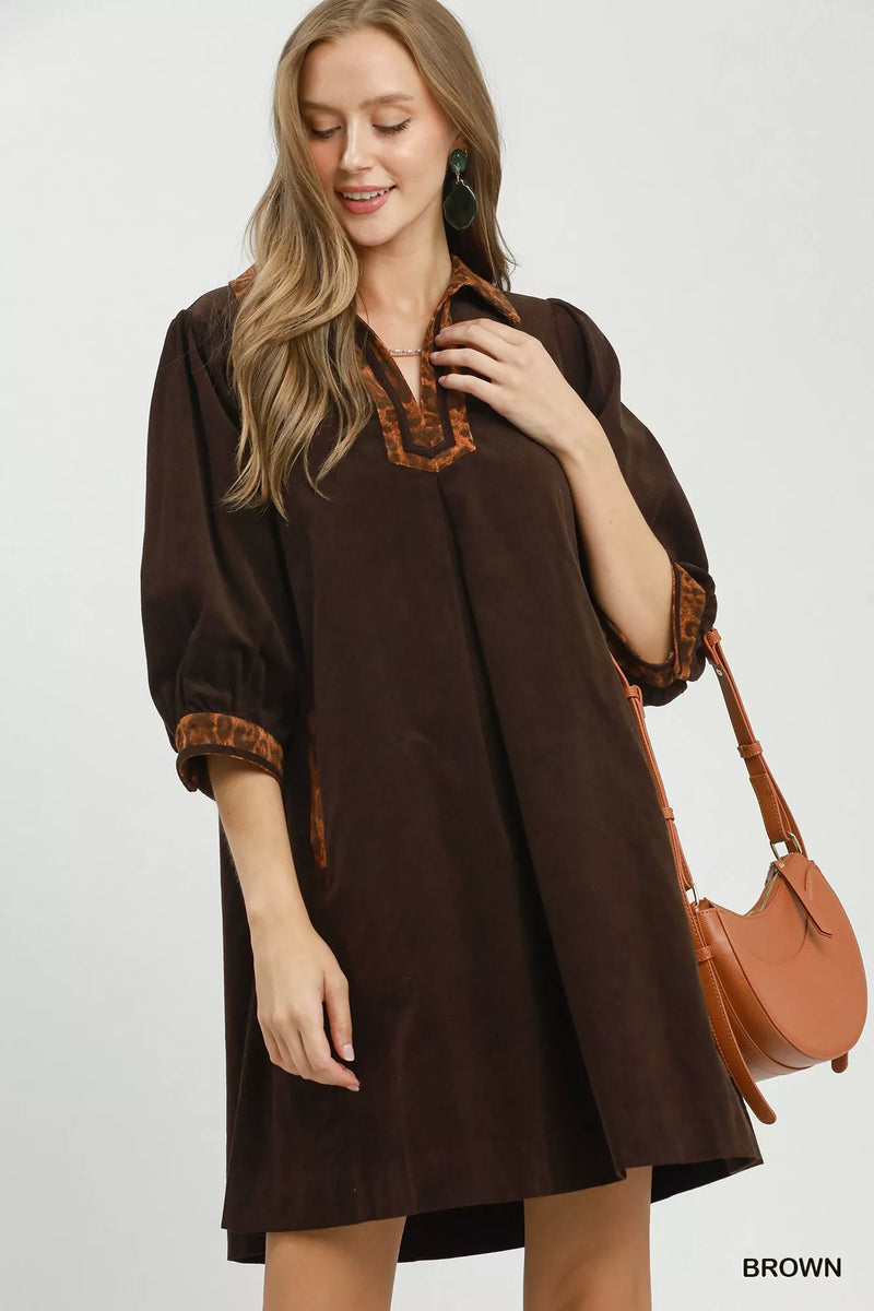 Brown V neck shift dress with contrast trim front view