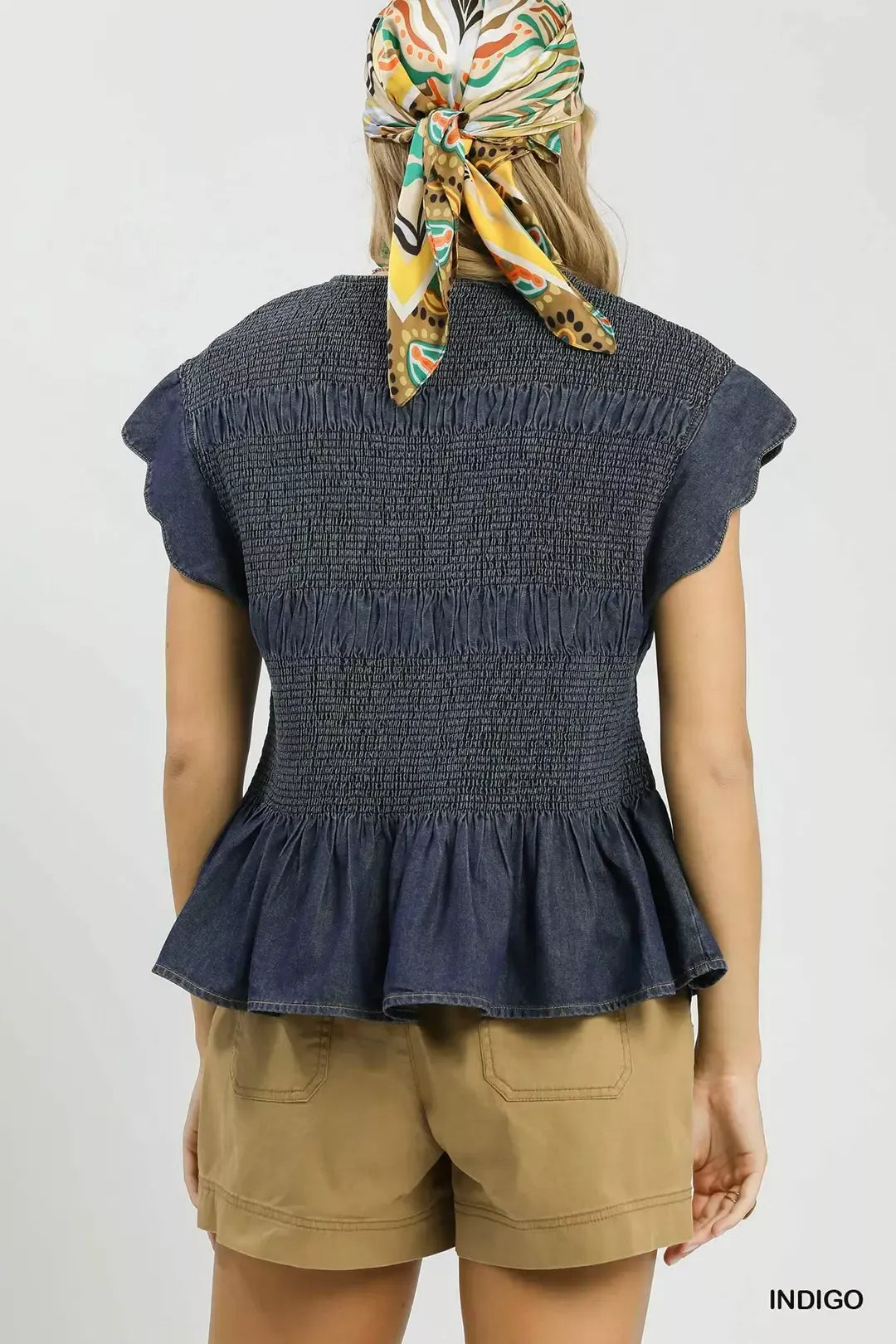 Indigo chambray peplum top side view