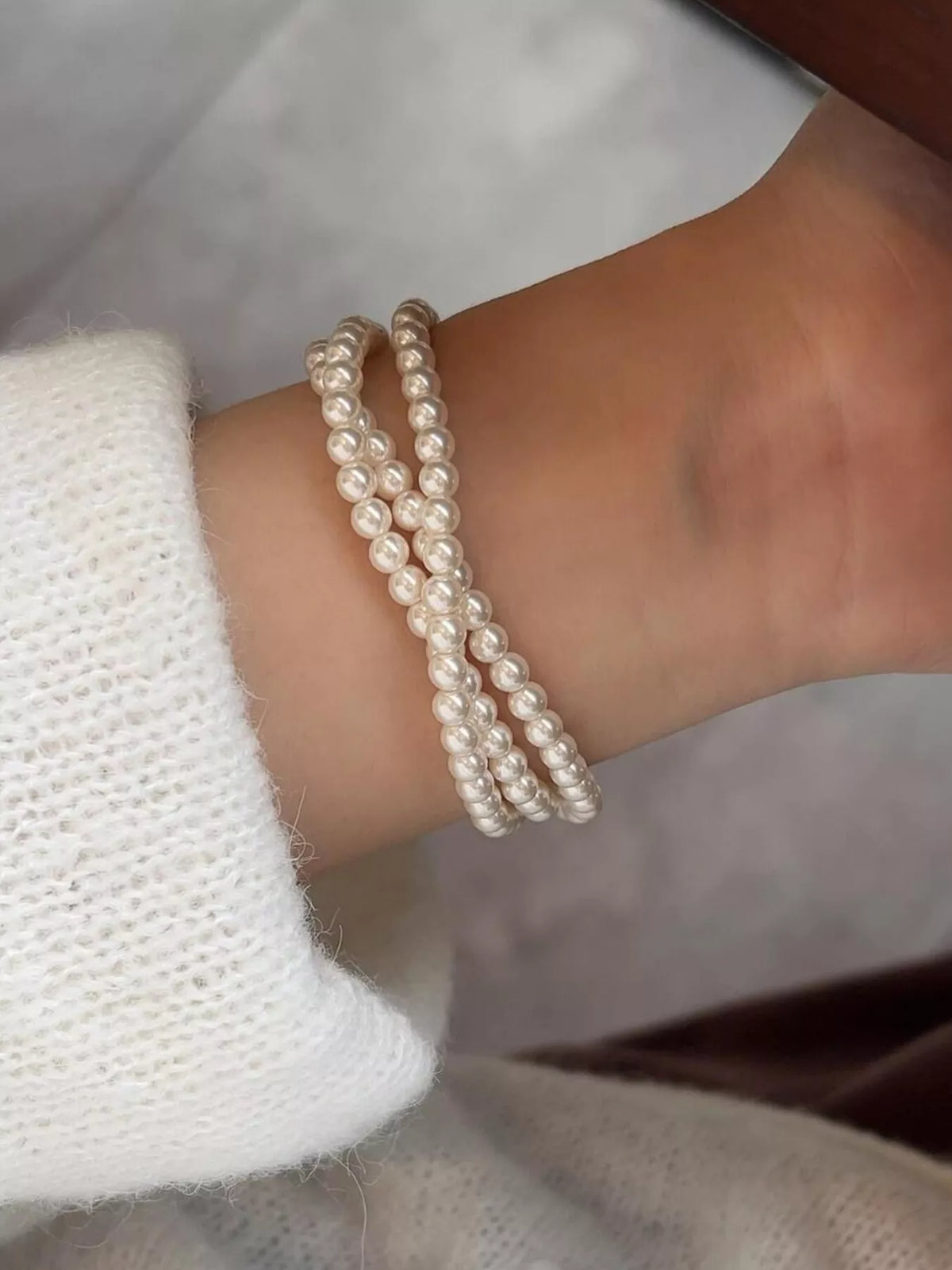 Layered pearl bracelet clasp detail