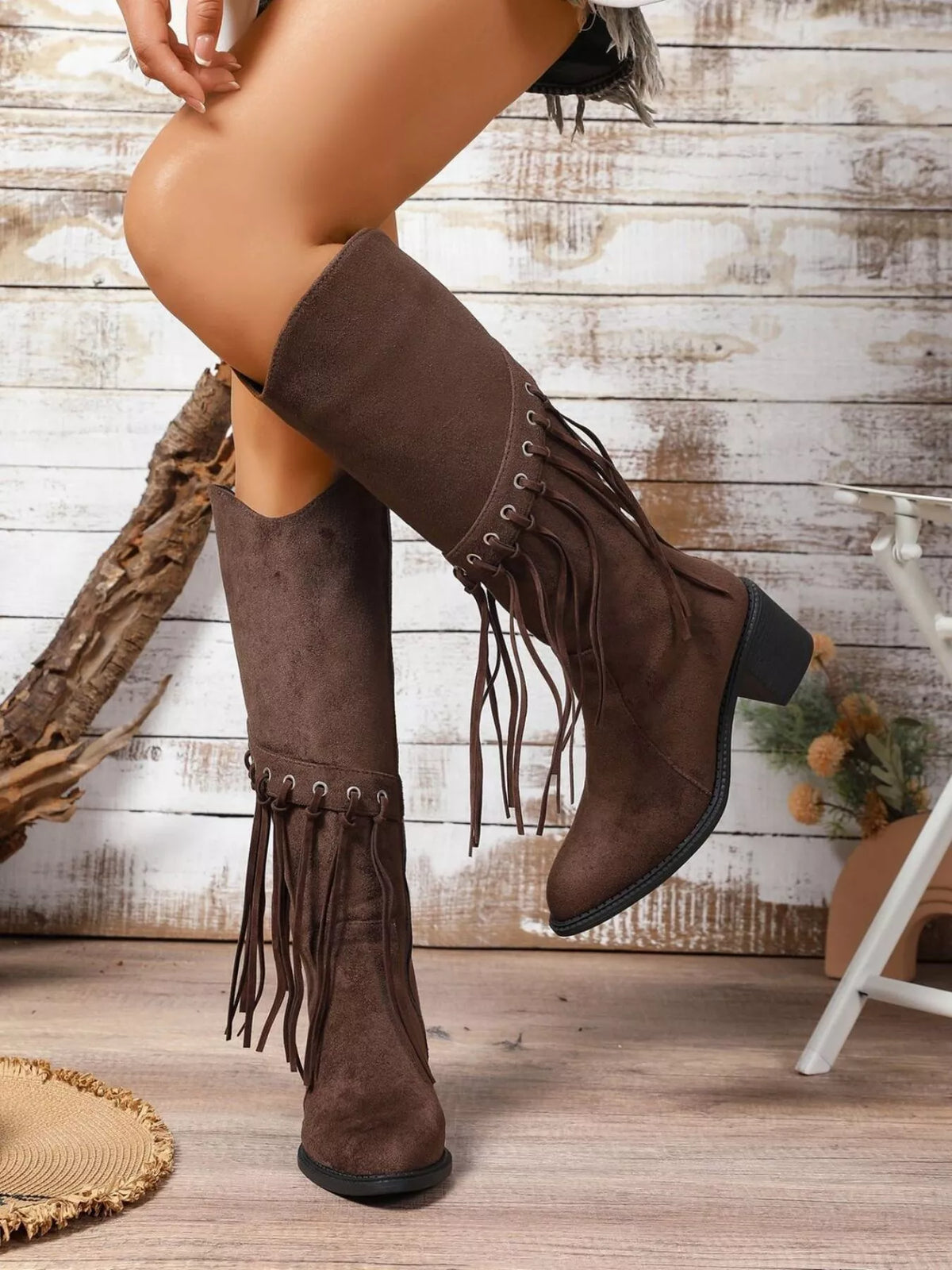 Fringe pointed toe block heel boots heel and sole detail