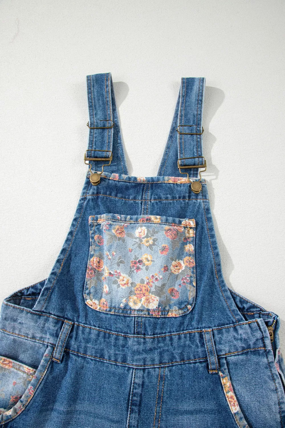 Pleated overall pocket detail