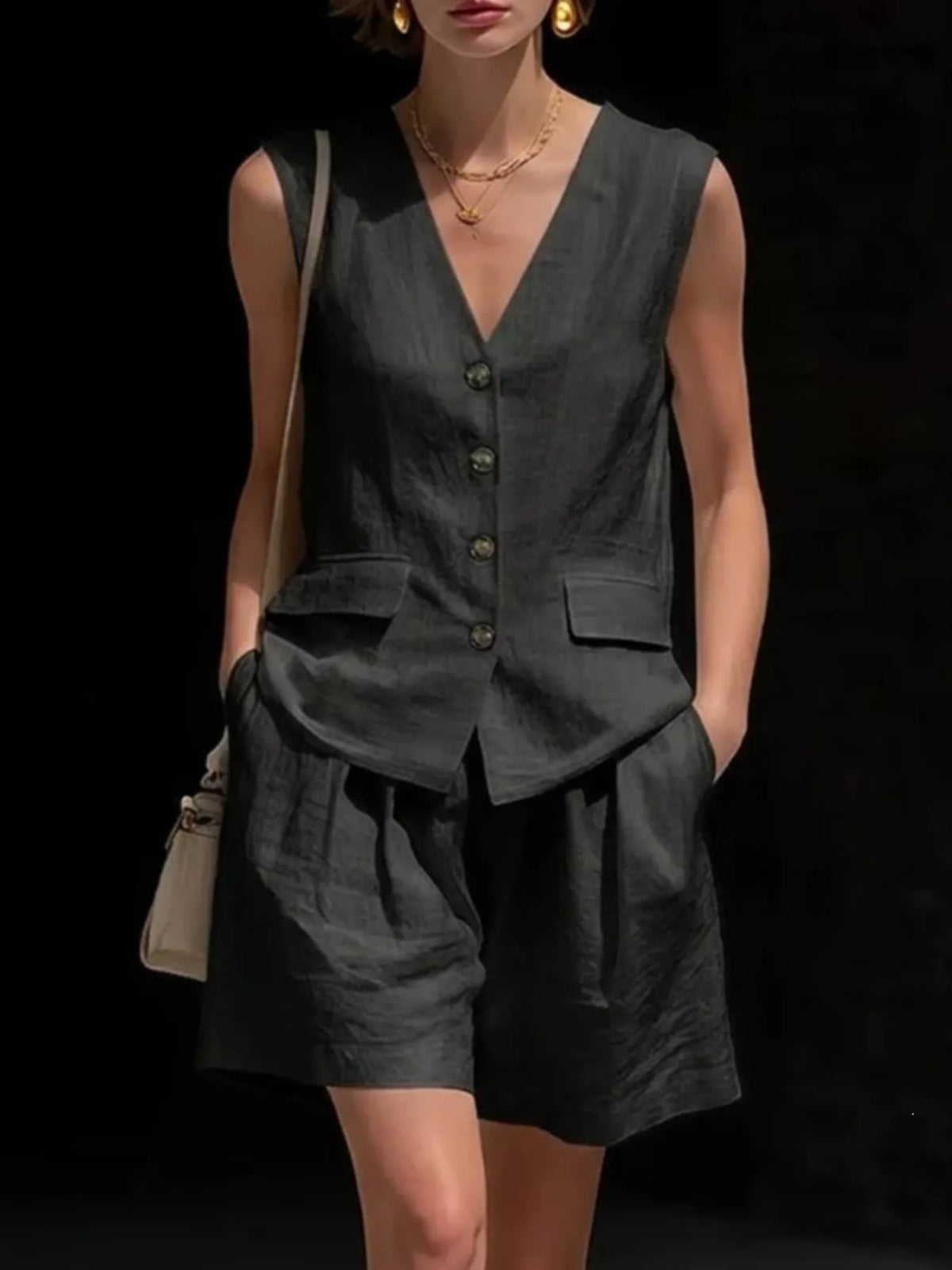 Two piece vest and shorts set styled on model, full length view