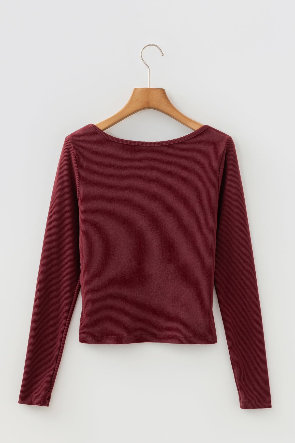 Cropped long sleeve top styled with high waist bottoms