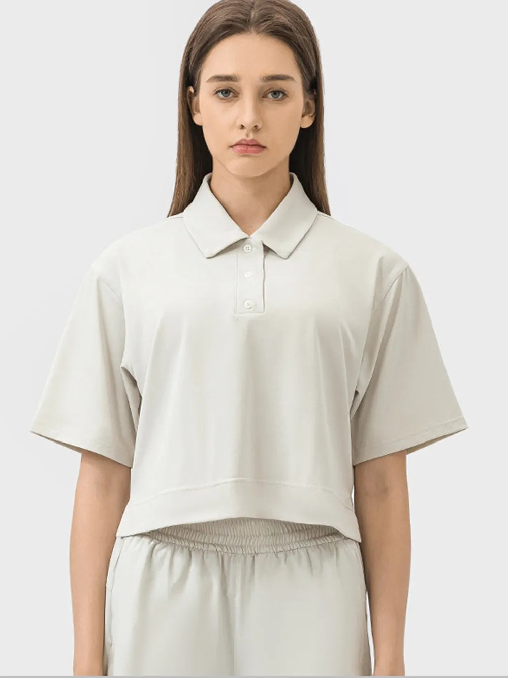 Half button short sleeve active tee side view