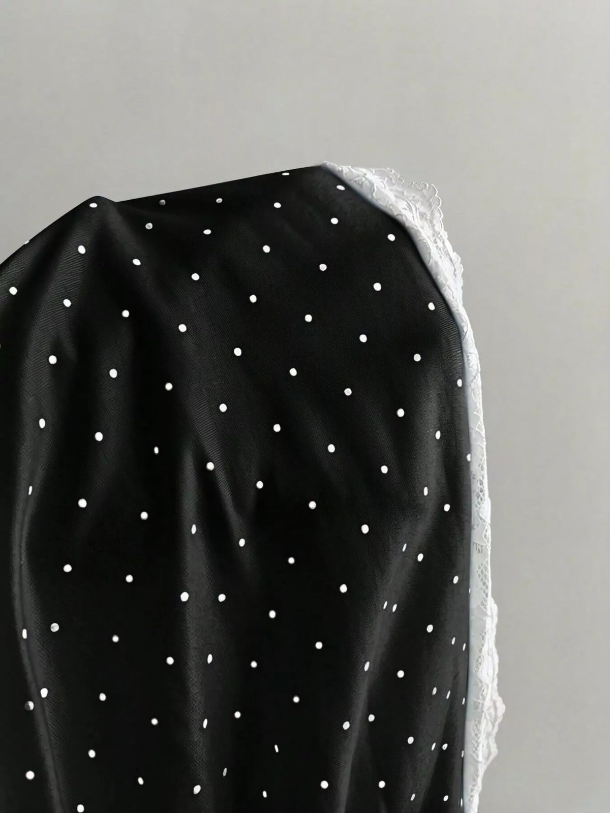 Lace trim detail on the polka dot cami