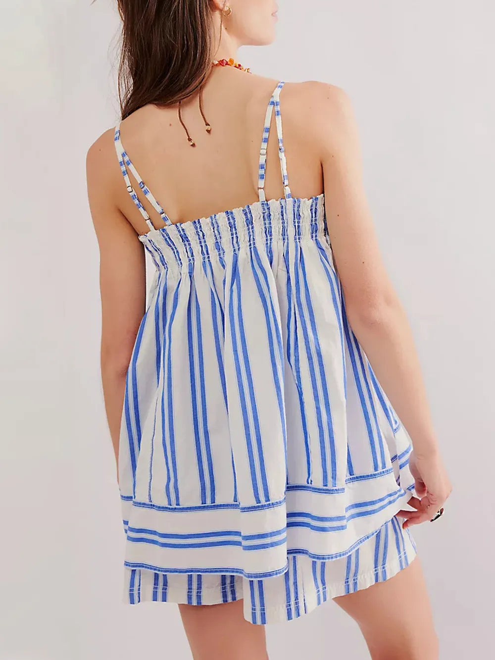 Blue smocked two piece summer set on model