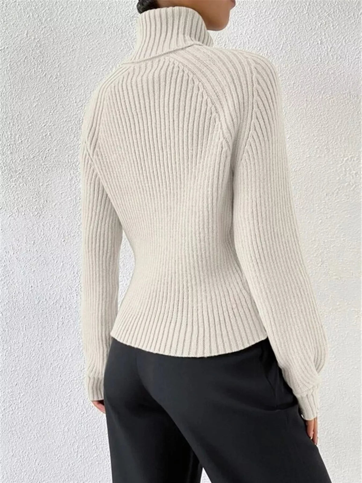 Ribbed turtleneck sweater sleeve detail