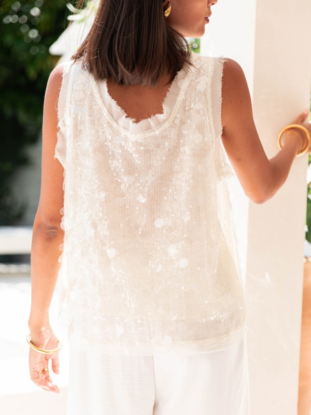 Three quarter view of the sequin top