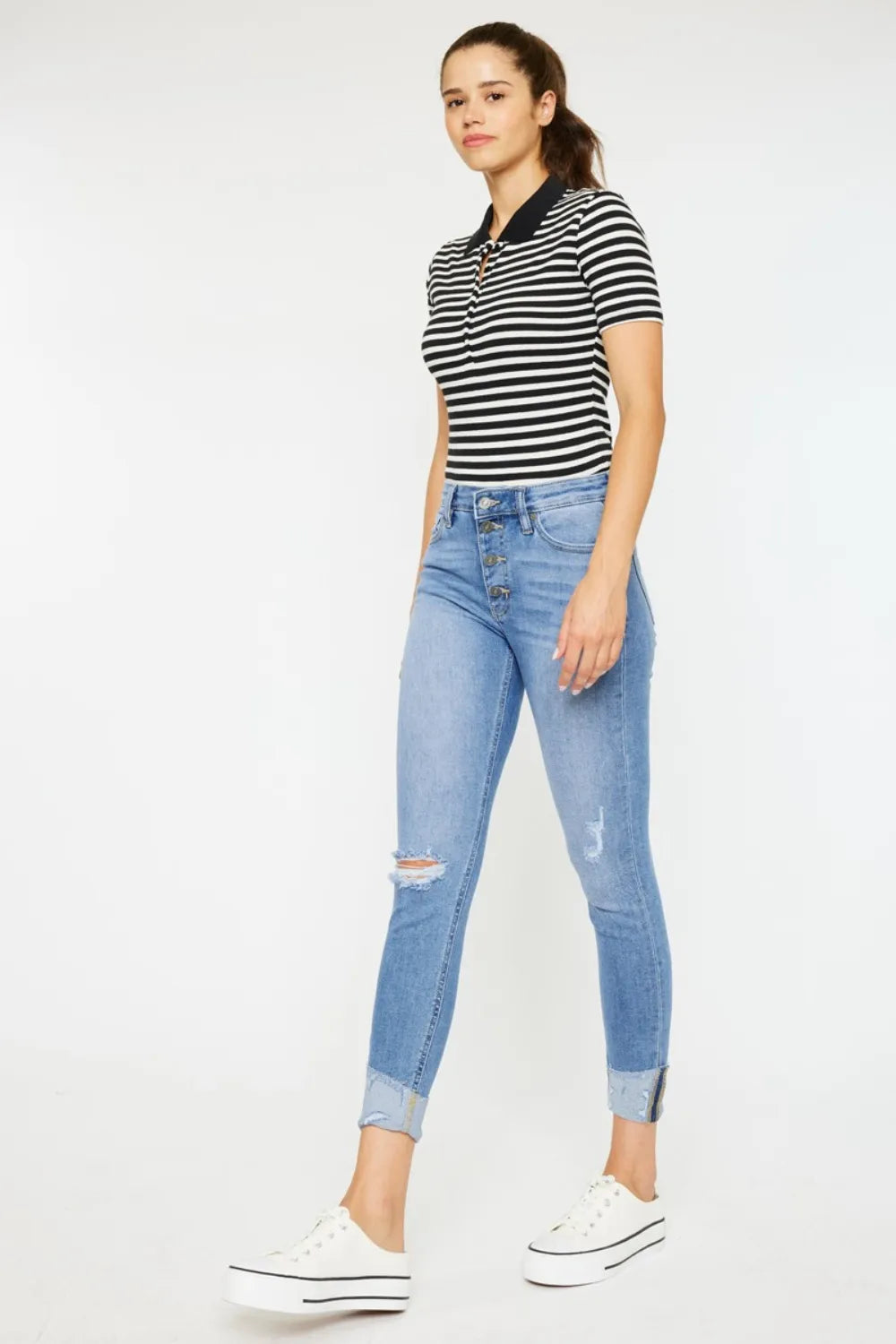 Whiskered fading detail on light wash jeans