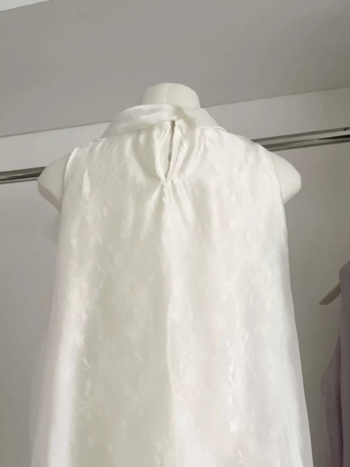 Bow chiffon sleeveless top, side view