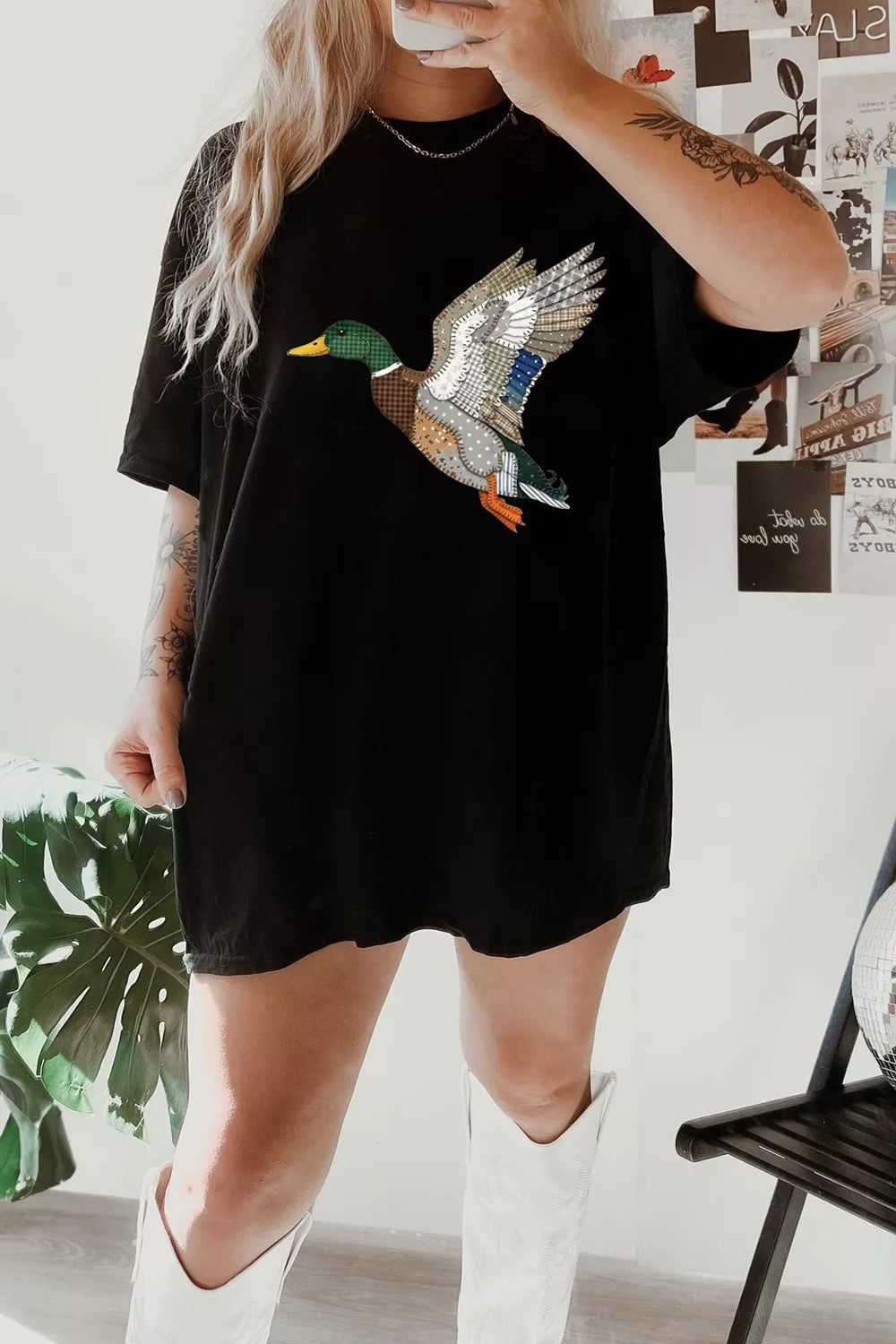 Black graphic tee shown from the side