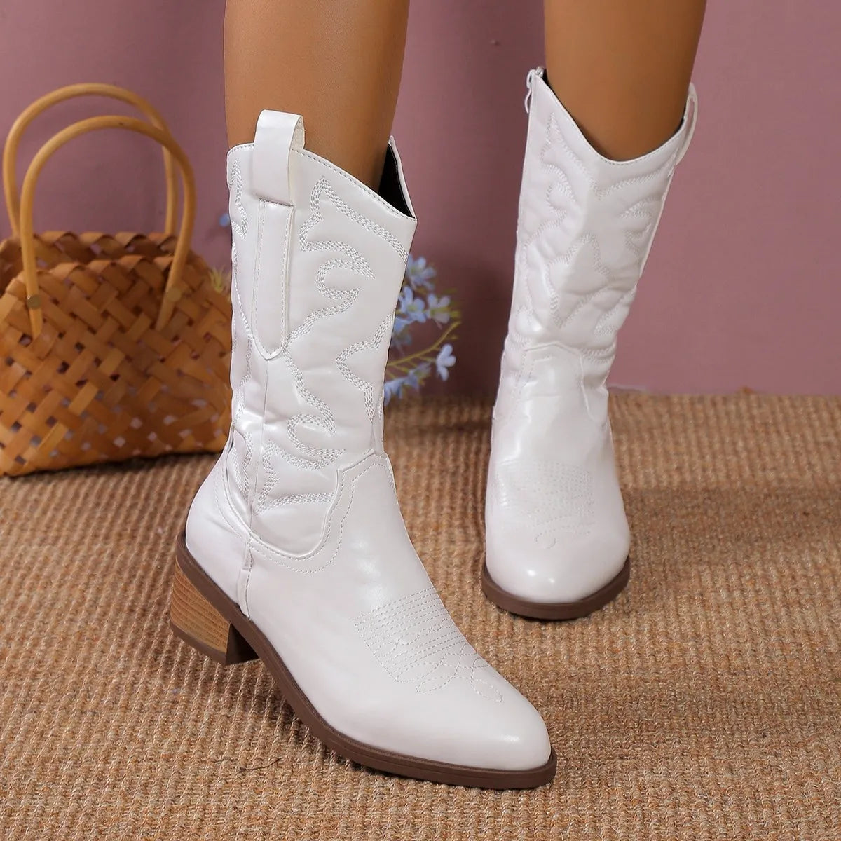 Point toe block heel boots three quarter view