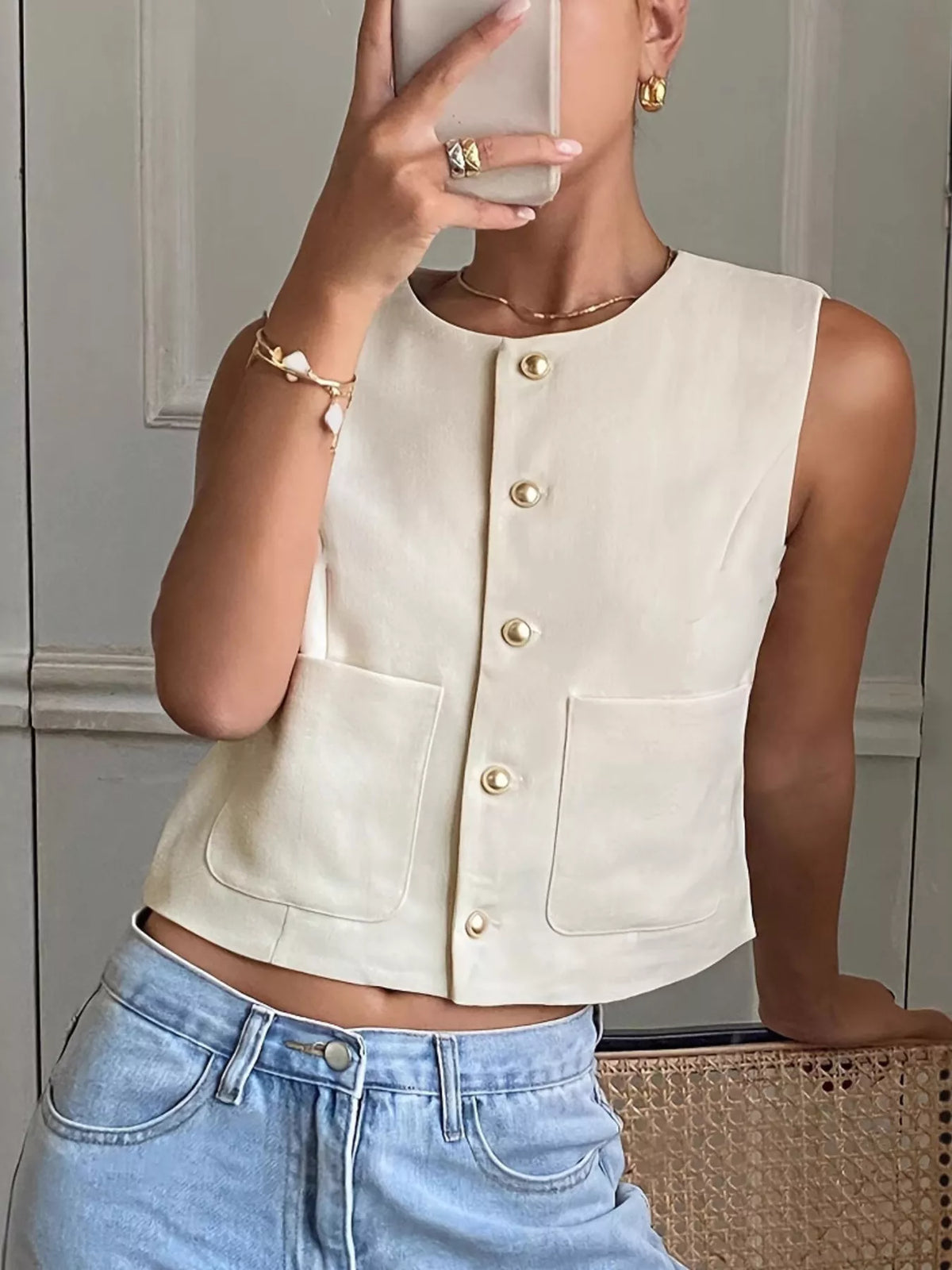 Beige button down sleeveless utility vest styled view