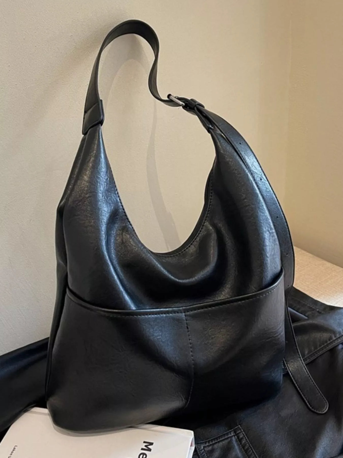 Black leather bag hardware detail